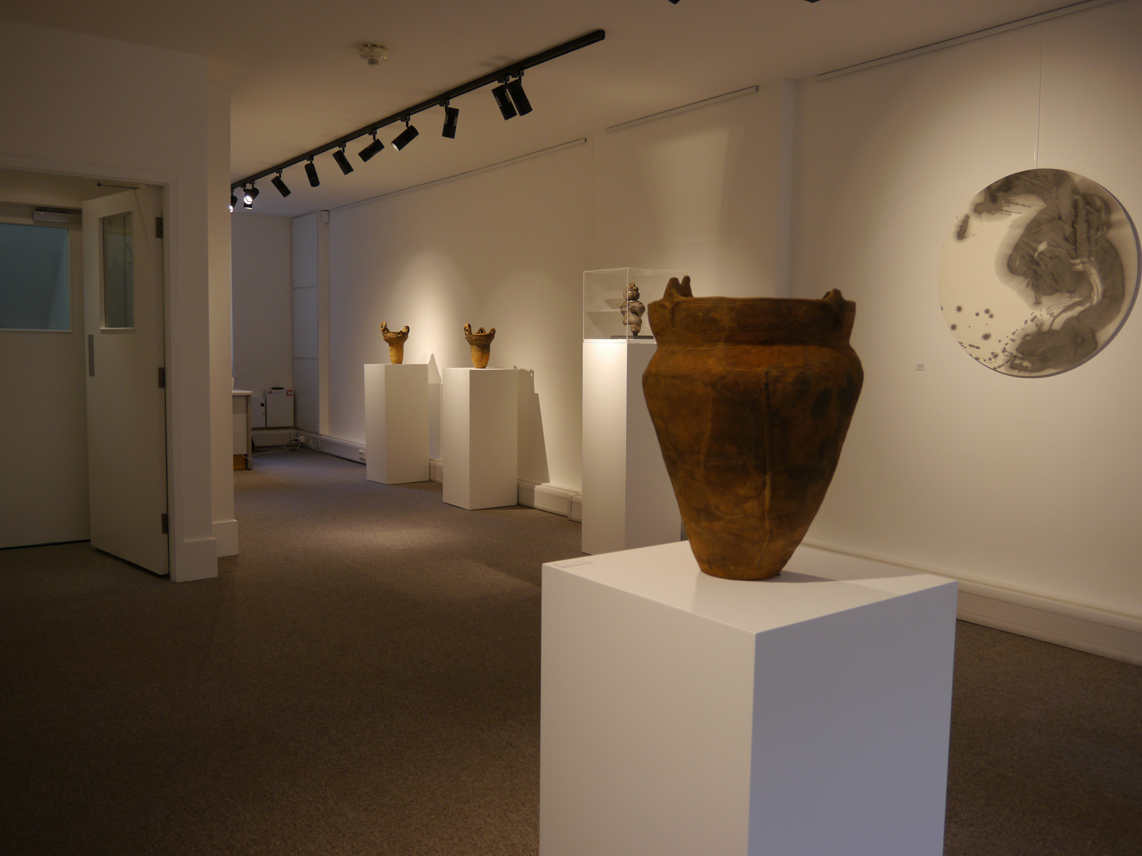 Minimalist 2nd Floor gallery with elegant lighting for art exhibitions and corporate events.