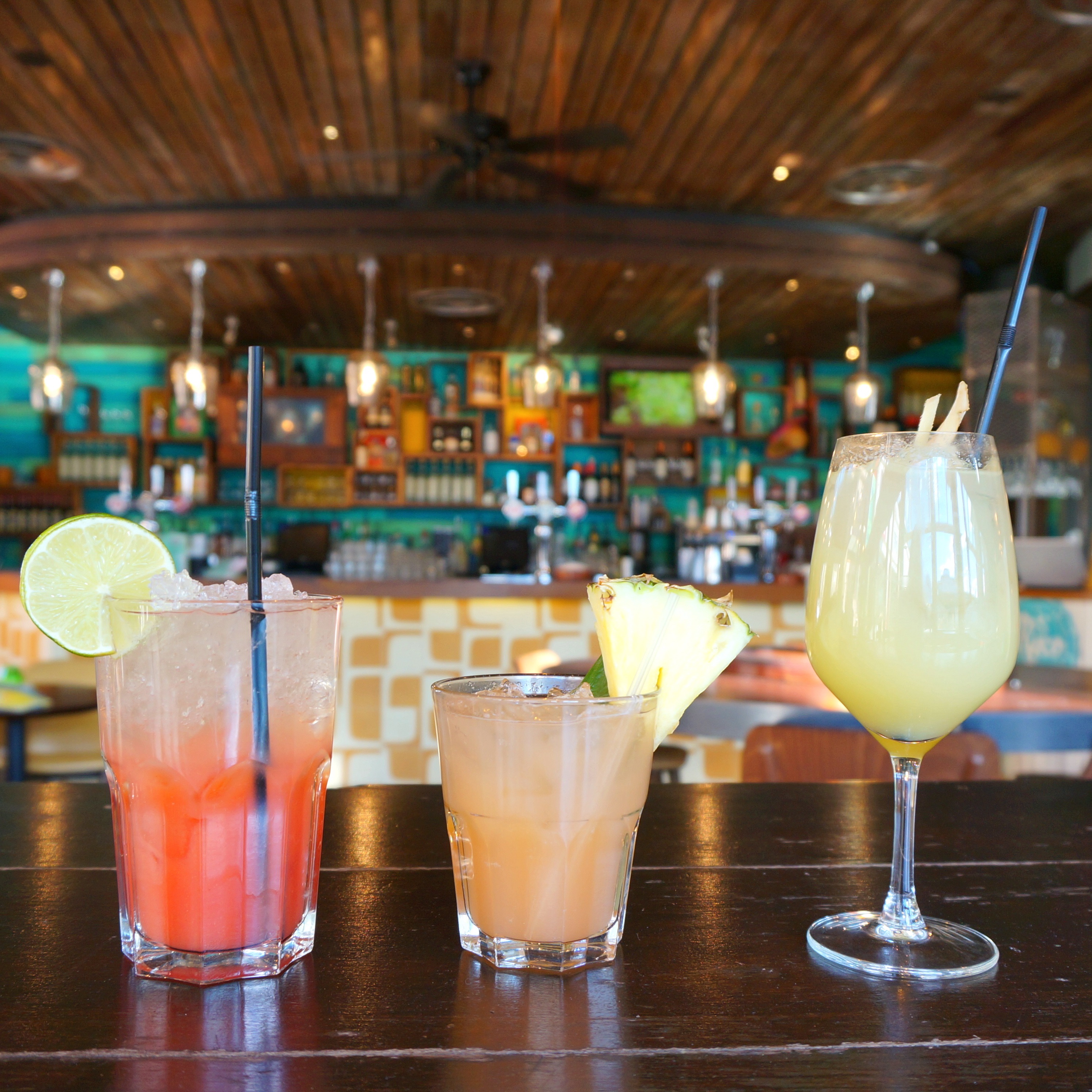 Colorful cocktails in vibrant bar at Las Iguanas Edinburgh, perfect for events and gatherings.