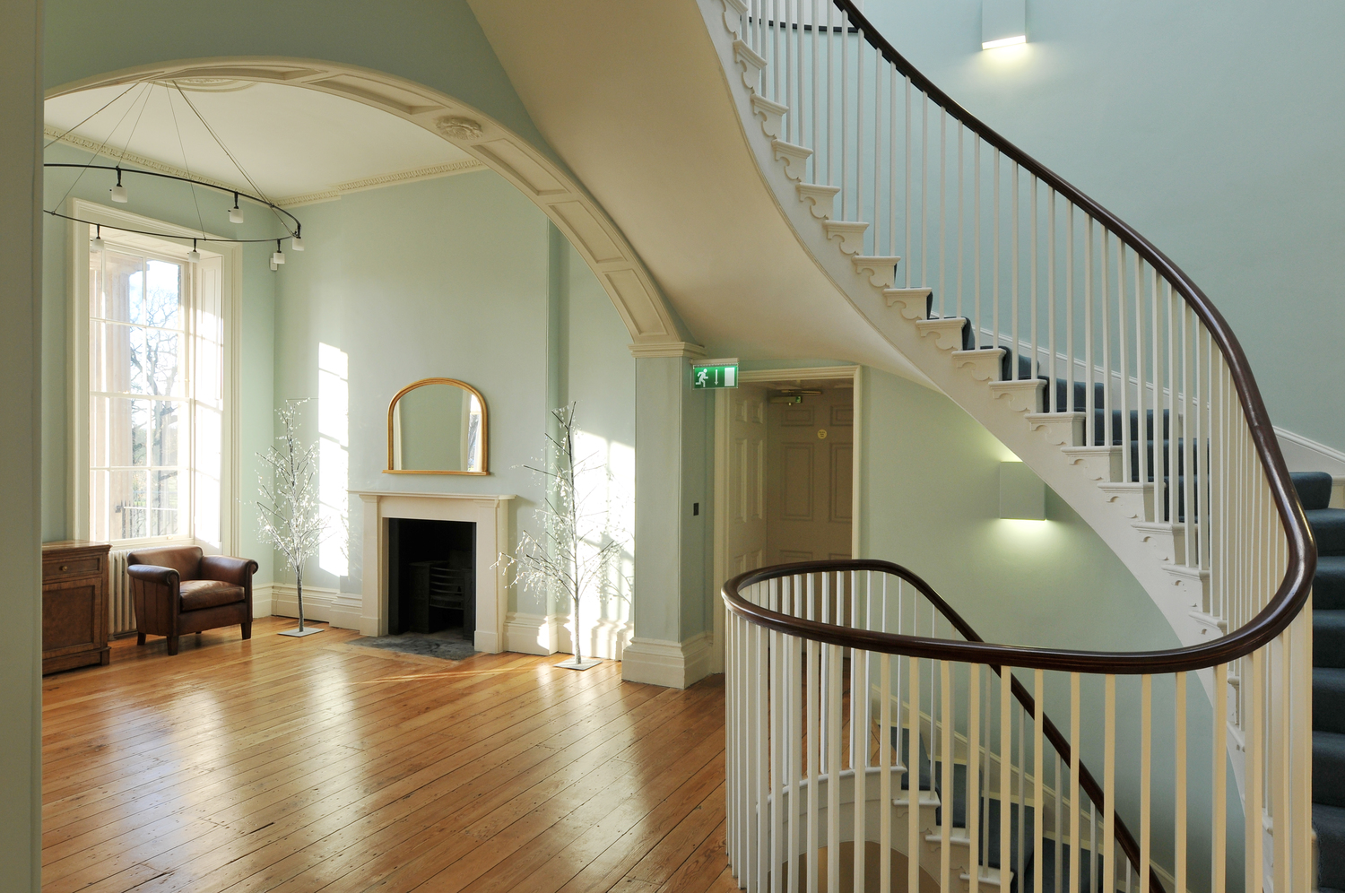 Elegant Drawing Room in Clissold House with sweeping staircase, perfect for receptions.