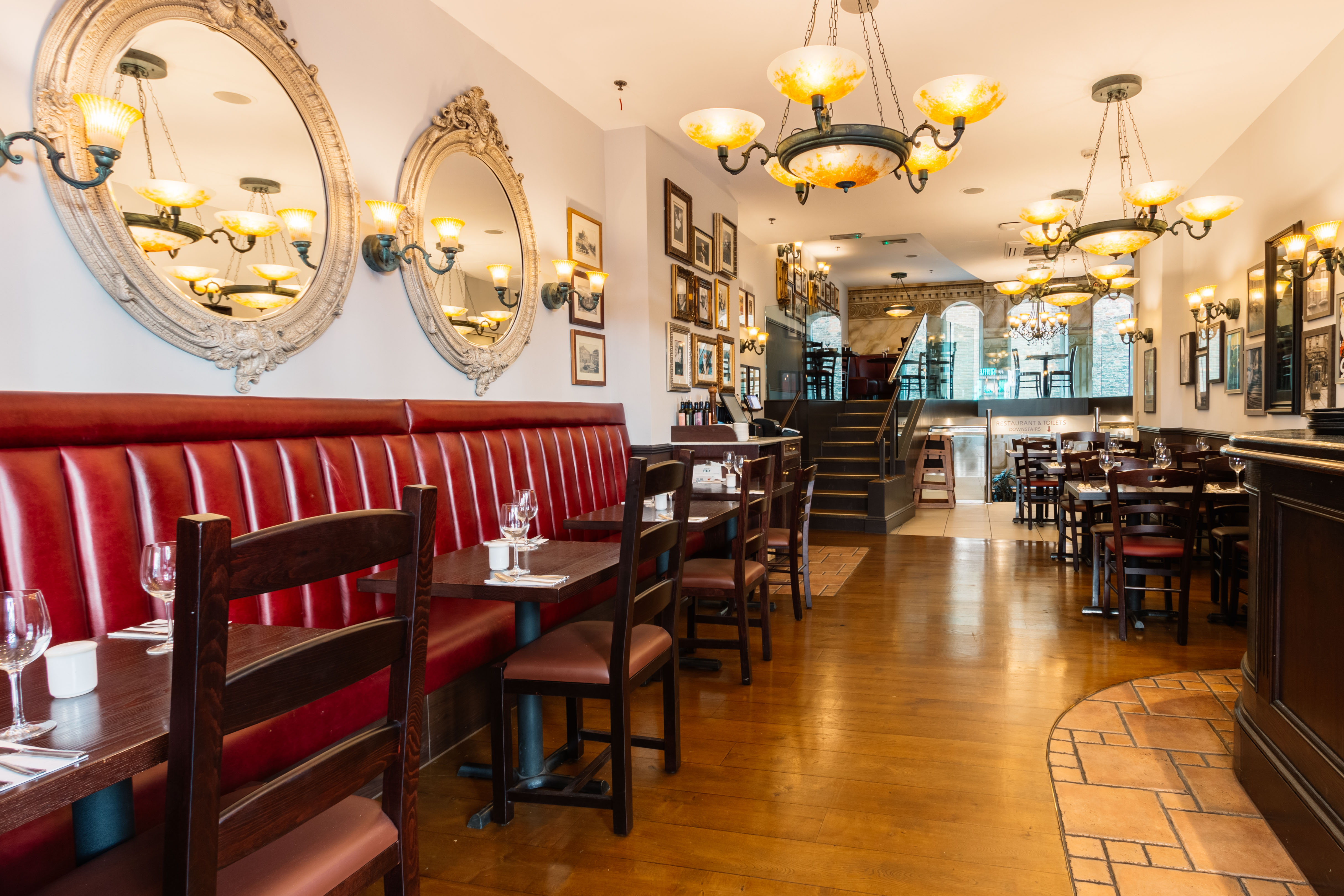 Stylish Bella Italia Strand venue with warm lighting for intimate gatherings and events.