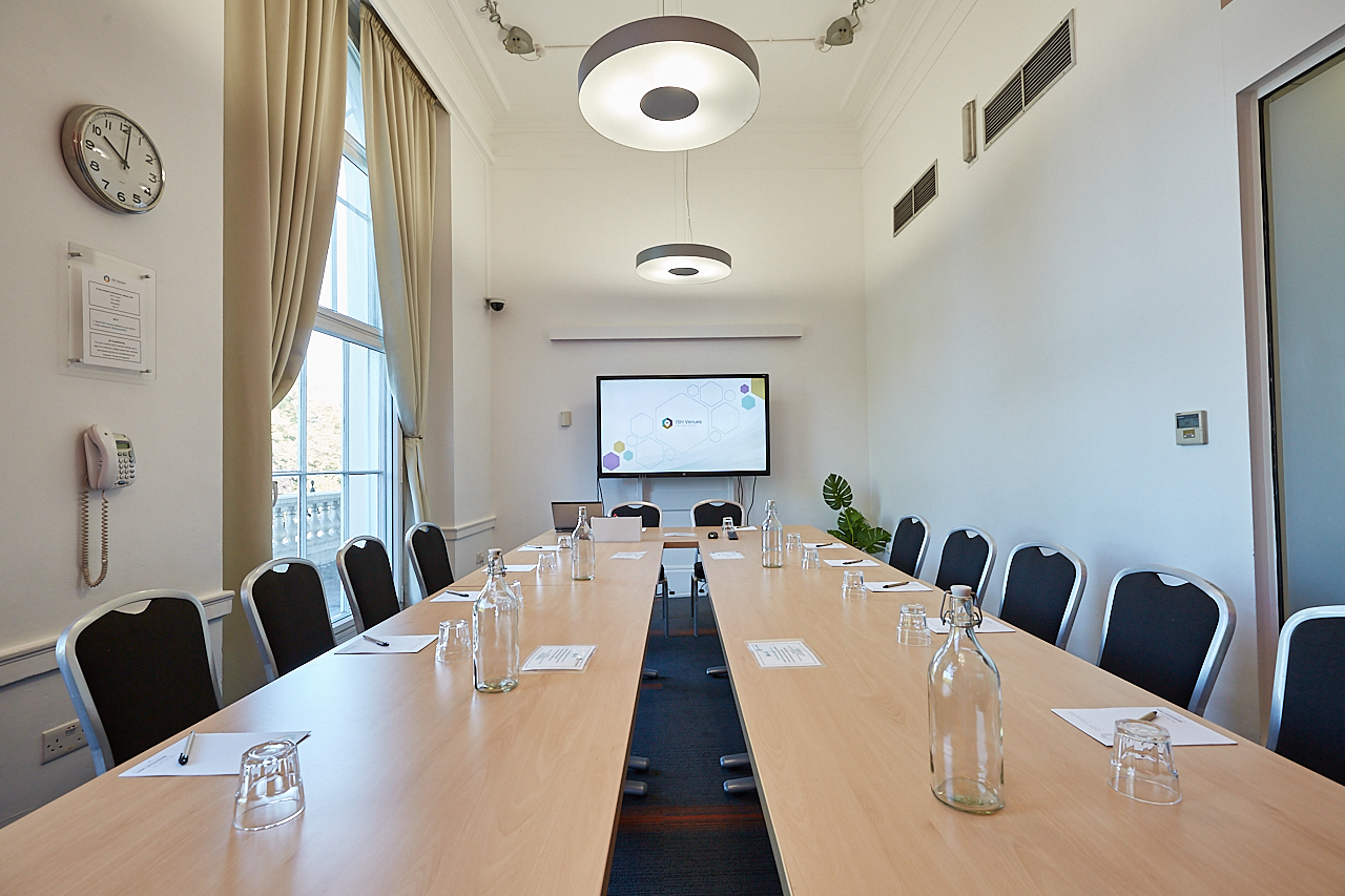 Meeting room at The Marylebone, featuring a long table for professional gatherings.