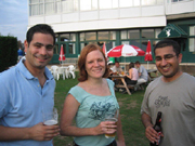 Outdoor networking event at Dragon's & Lion's Suites, featuring engaged attendees and ample seating.