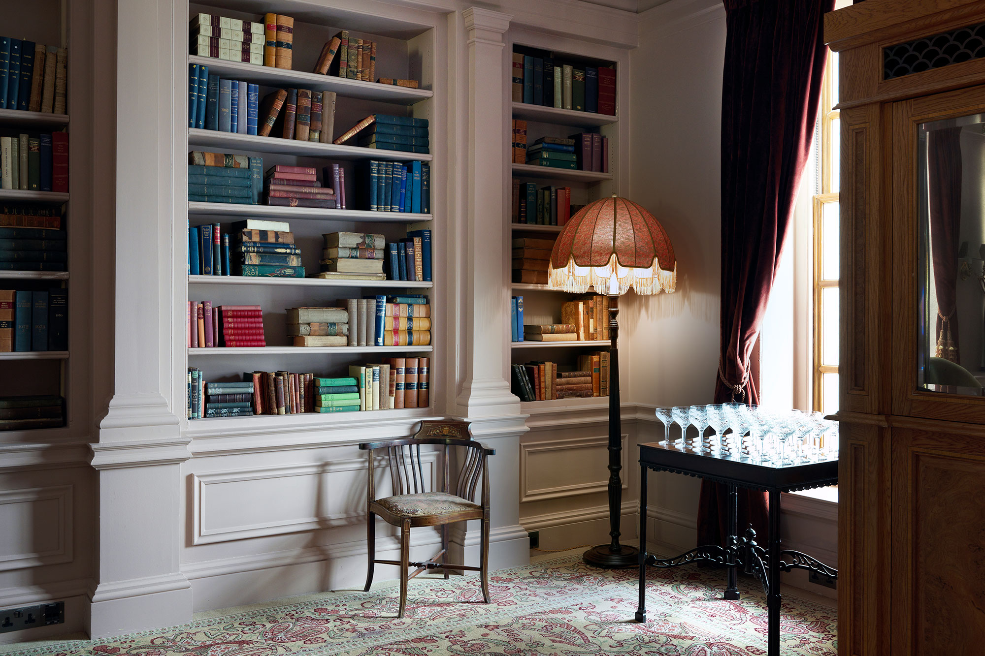 Sophisticated meeting space in The Ned with elegant lighting and polished table.