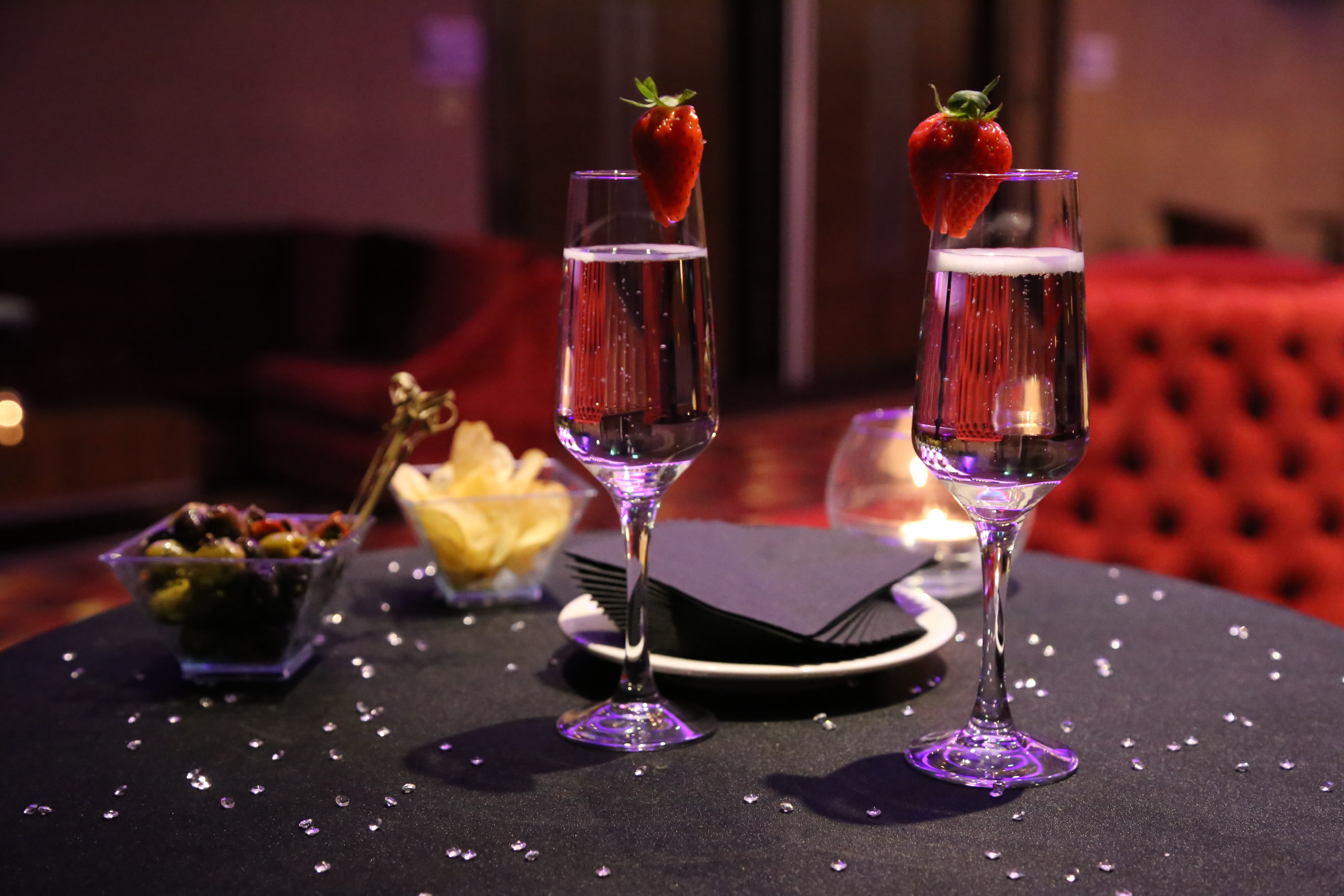 Elegant Buckingham Suite setup with sparkling water, ideal for networking events or celebrations.