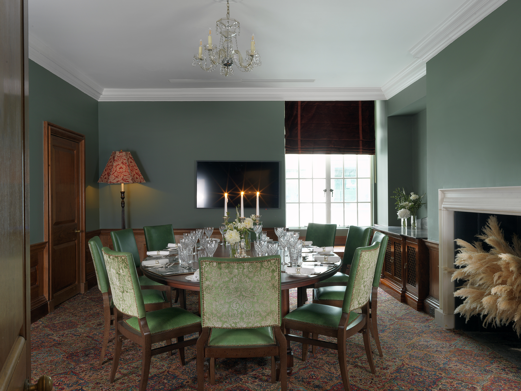Elegant Wren Room at The Ned, featuring a round table for intimate meetings and events.