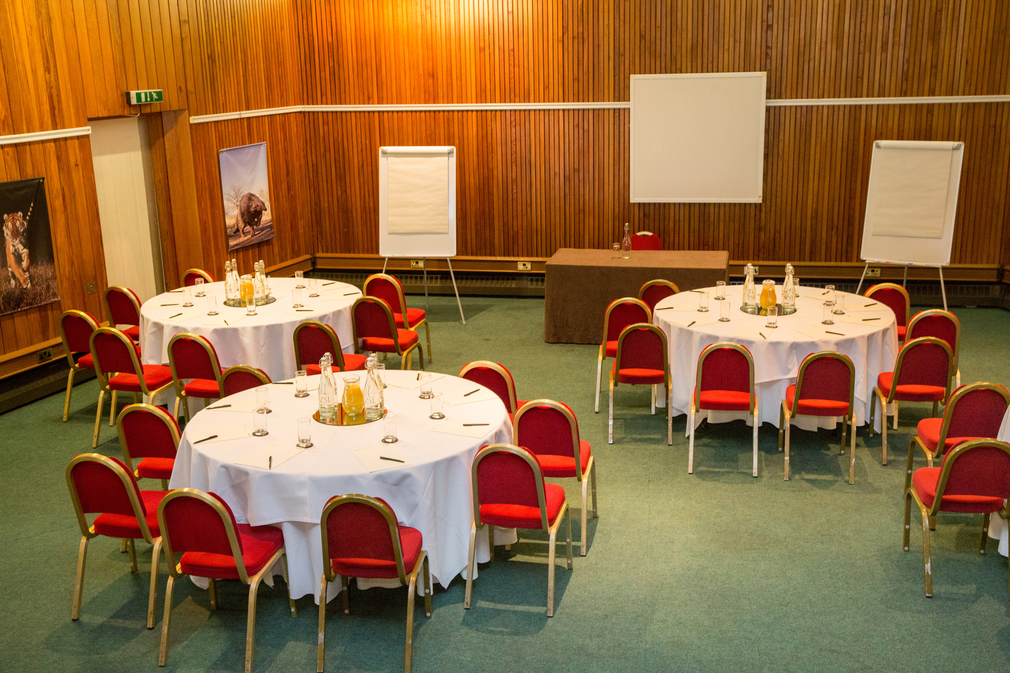 Huxley Theatre meeting space with round tables, ideal for workshops and conferences.