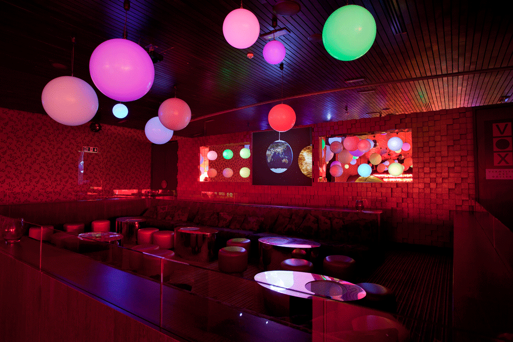 Vibrant Cinnabar event space with colorful lighting for cocktail parties and networking.