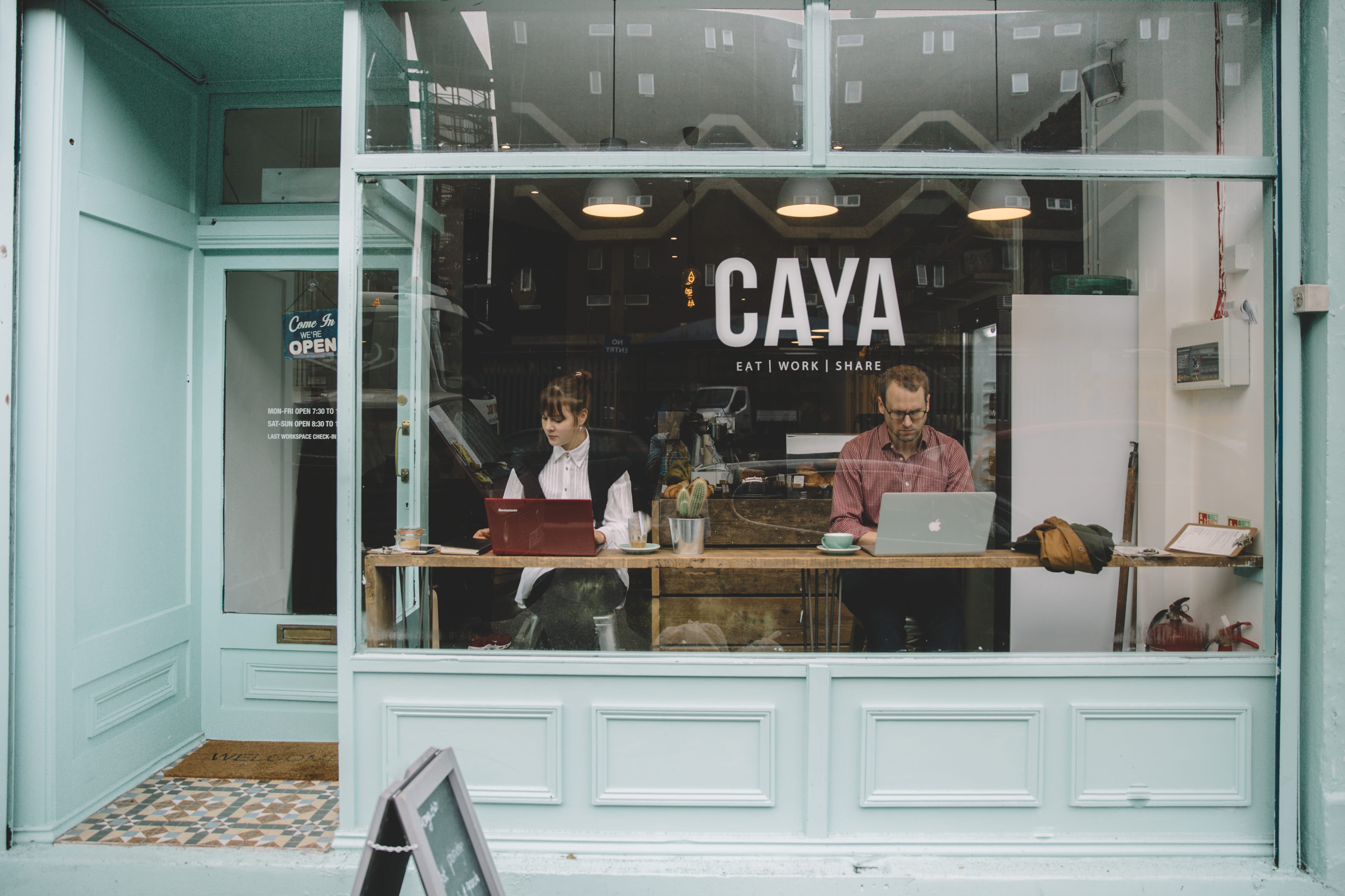 Cozy CAYA Event Space café with natural light for informal meetings and networking.