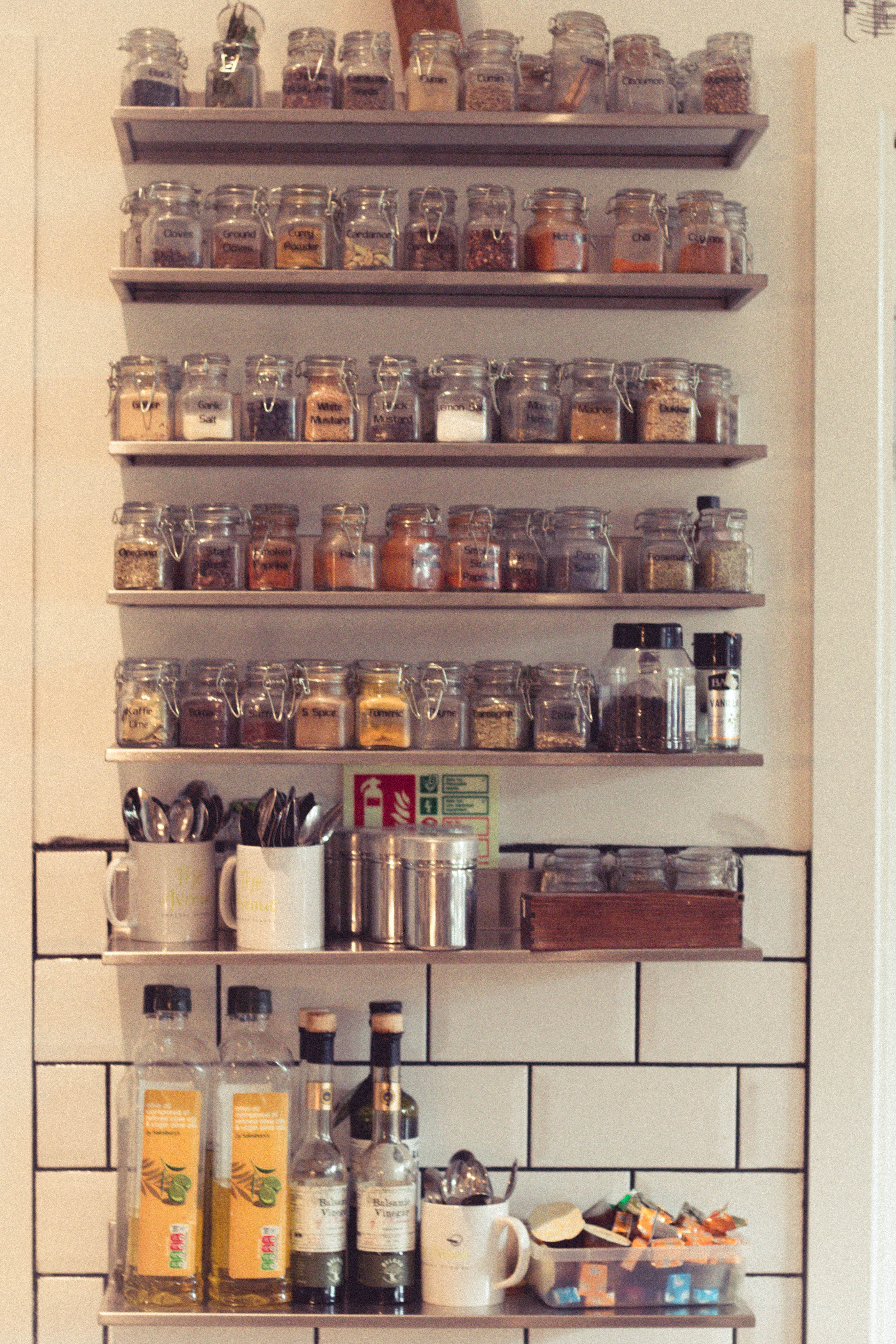 Professional kitchen for hire with organized spice rack, ideal for event planning.
