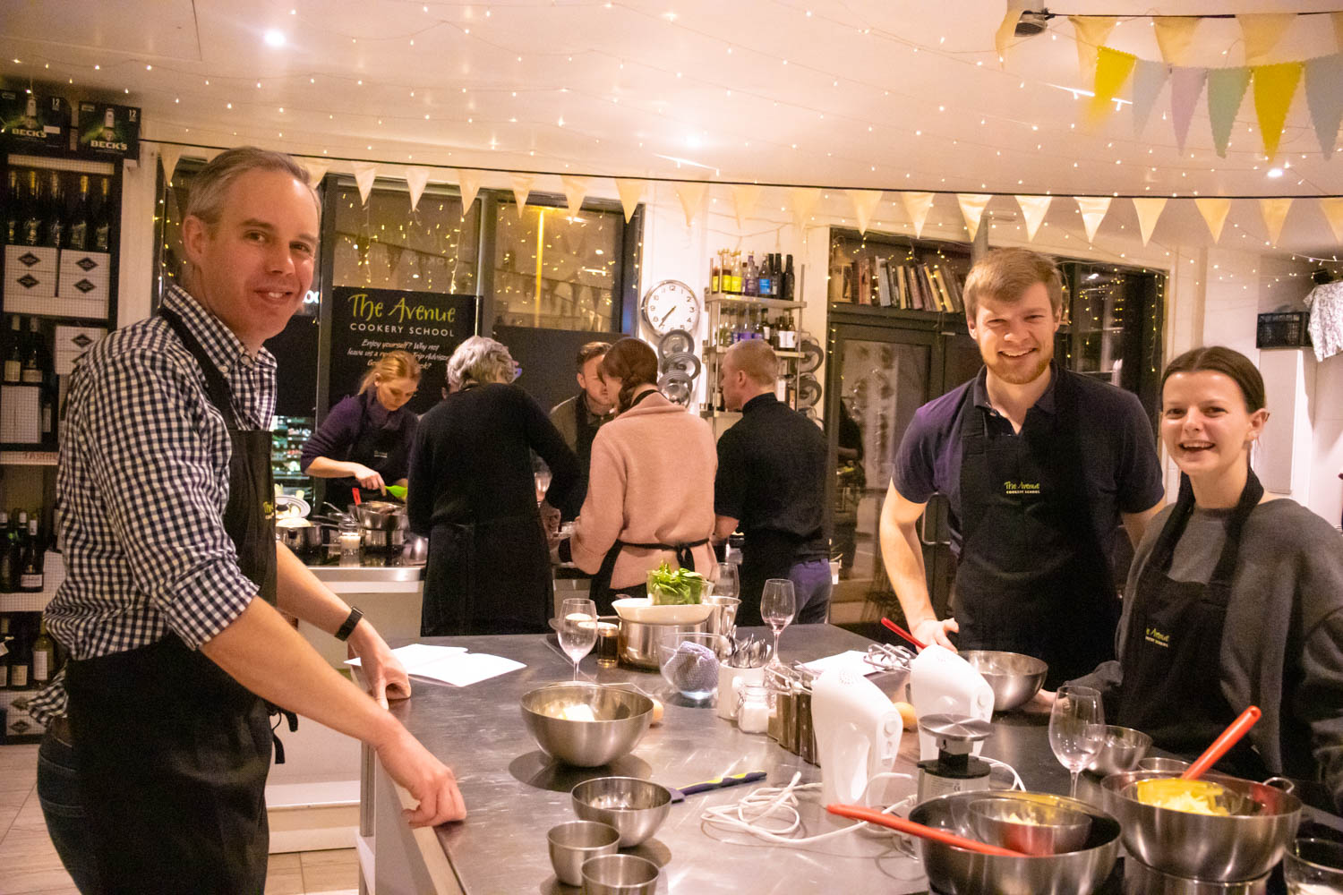 Vibrant cooking class in professional kitchen for team-building events.