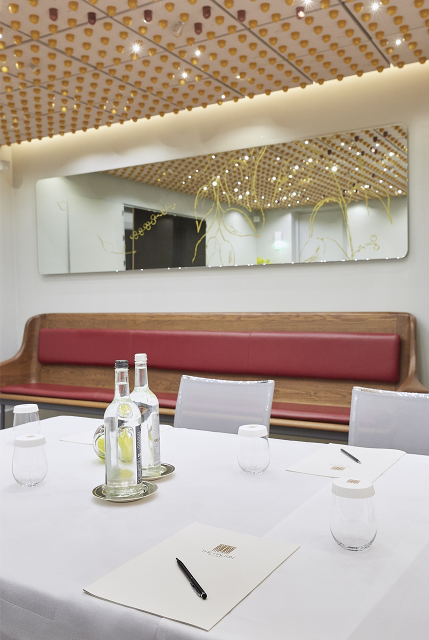 Private dining room at COMO The Halkin, featuring sleek design for meetings and events.
