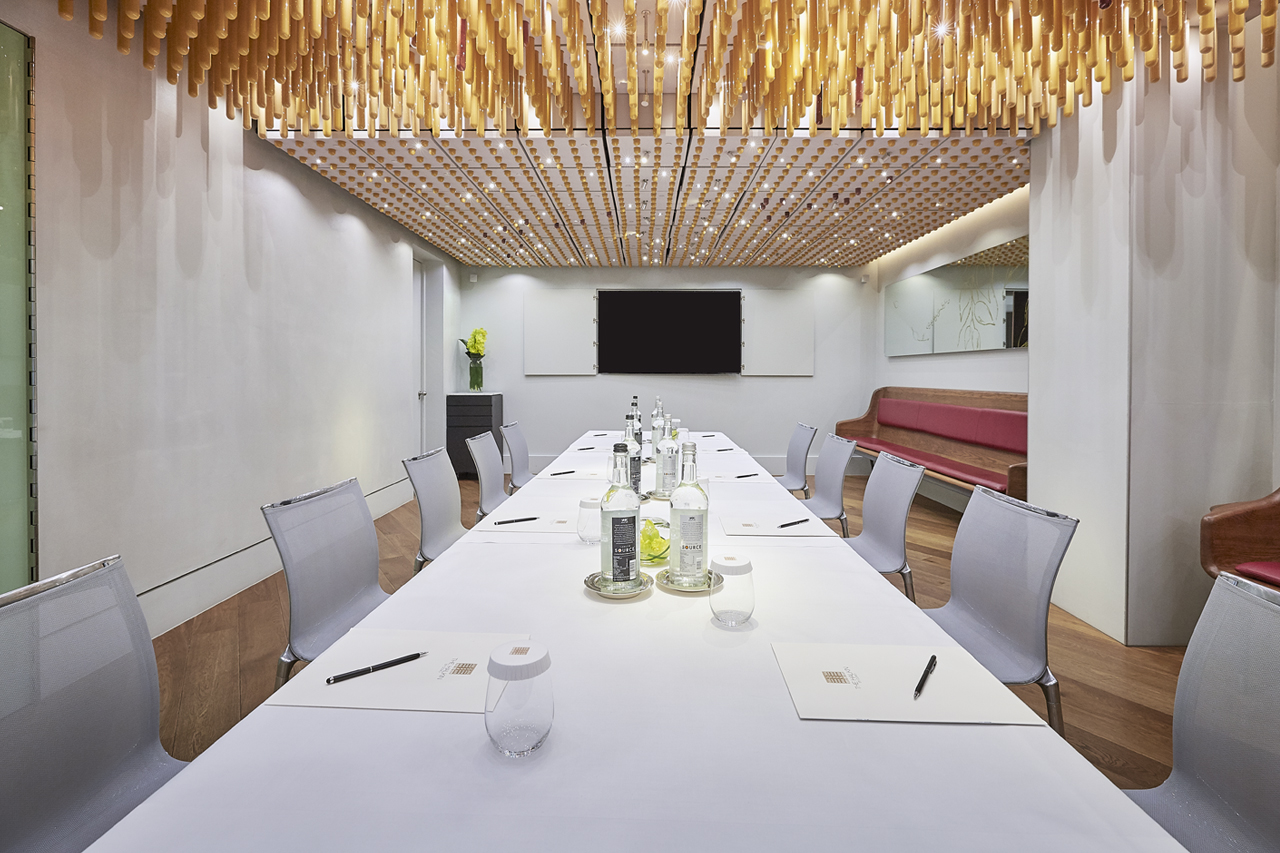 Private dining room at COMO The Halkin, featuring a long table for meetings and presentations.