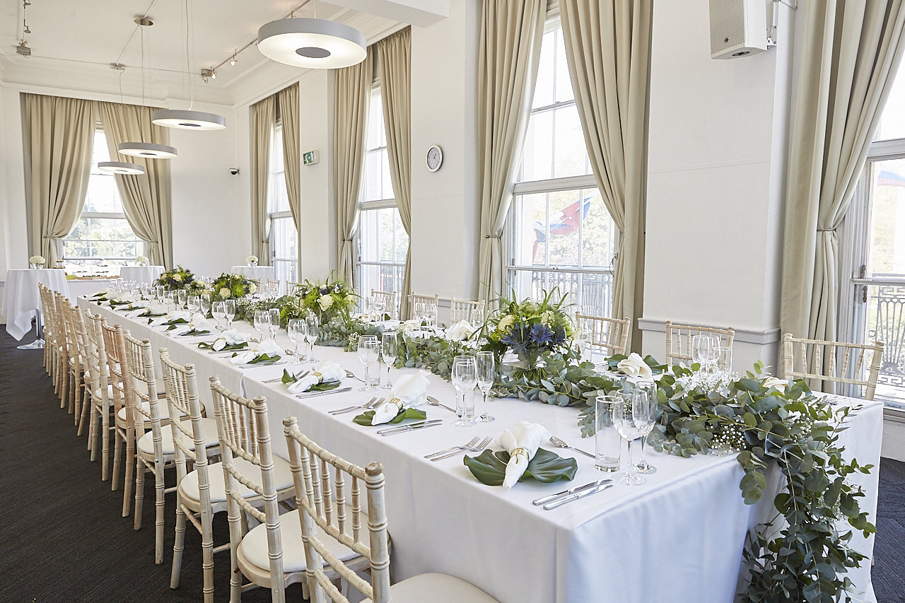 Elegant banquet setup in ISH Venues' Club Room for weddings and formal events.