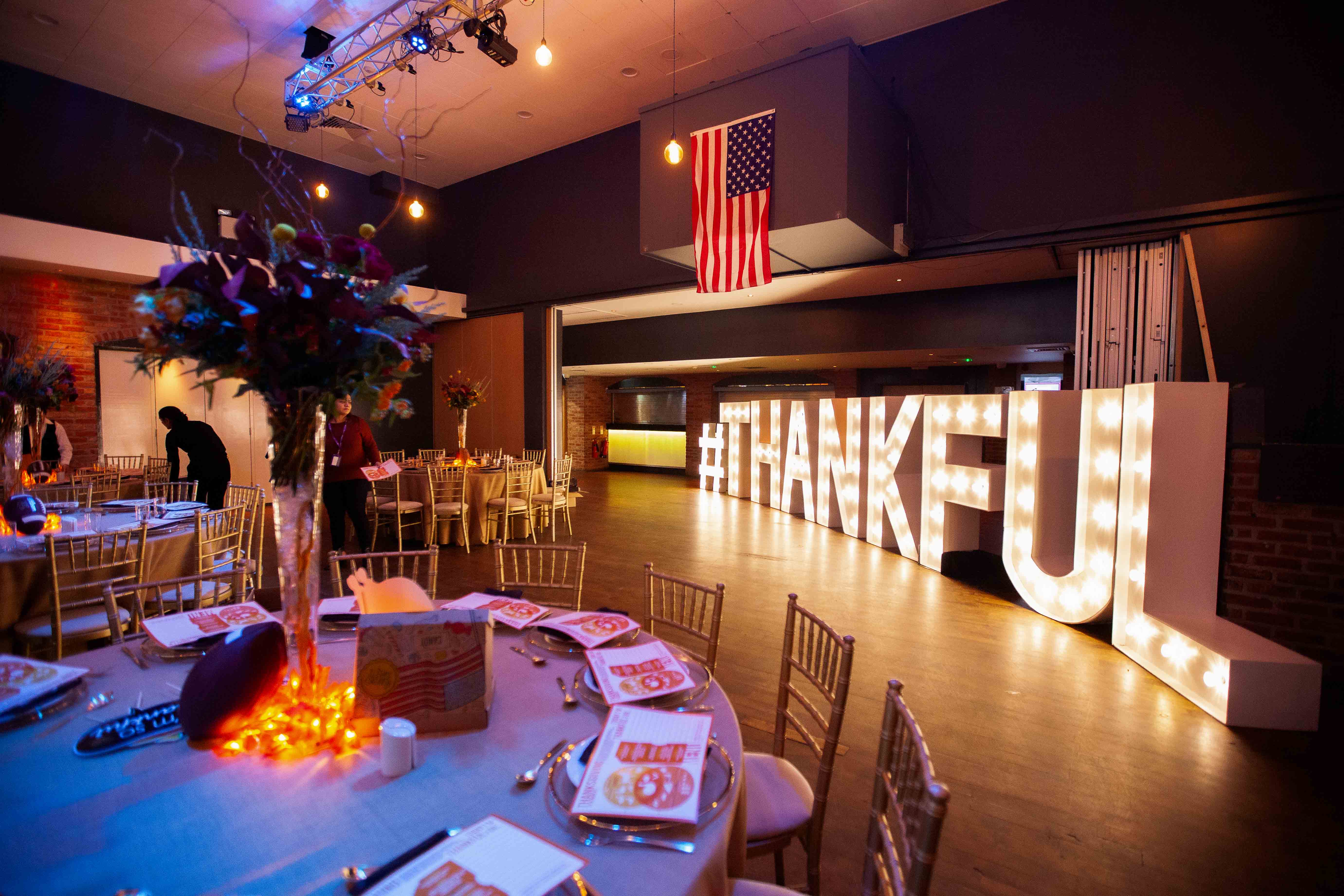 Elegant event space with "#THANKFUL" display, perfect for celebrations and corporate gatherings.