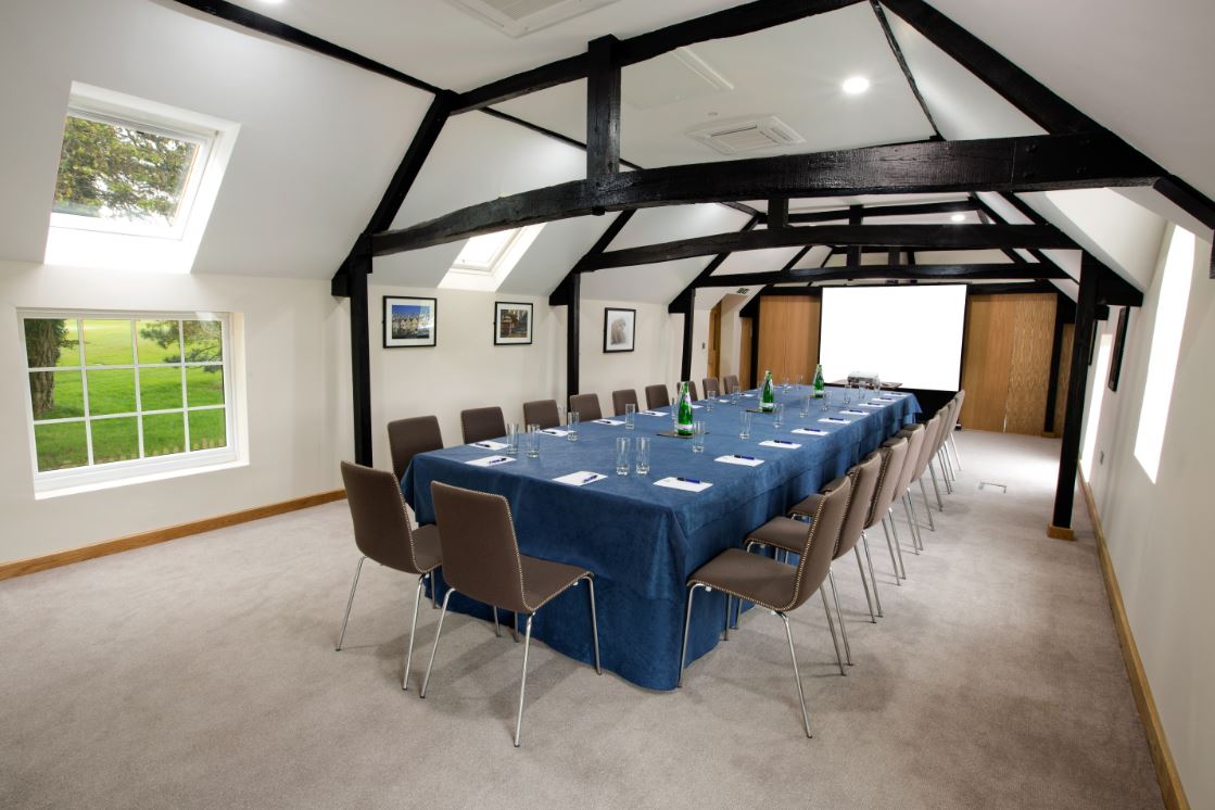 Clockhouse Suite meeting room with long table, ideal for workshops and strategy sessions.