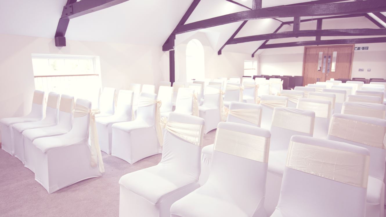 Elegant event space with draped chairs at Sandford Springs Hotel for weddings.