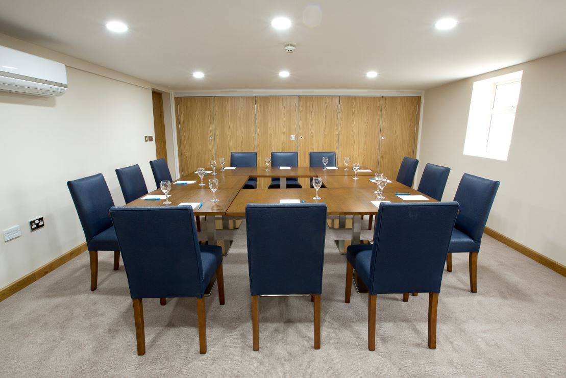Davies Suite meeting room at Sandford Springs Hotel, ideal for board meetings and workshops.