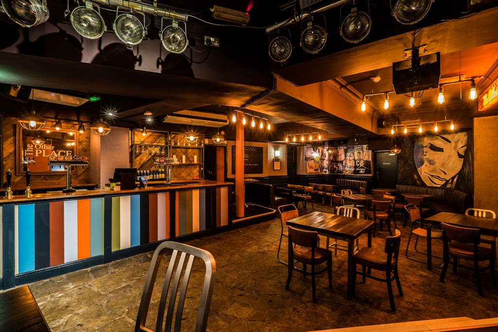 Versatile event space with vibrant bar, ideal for gatherings and networking in Albany W1W.