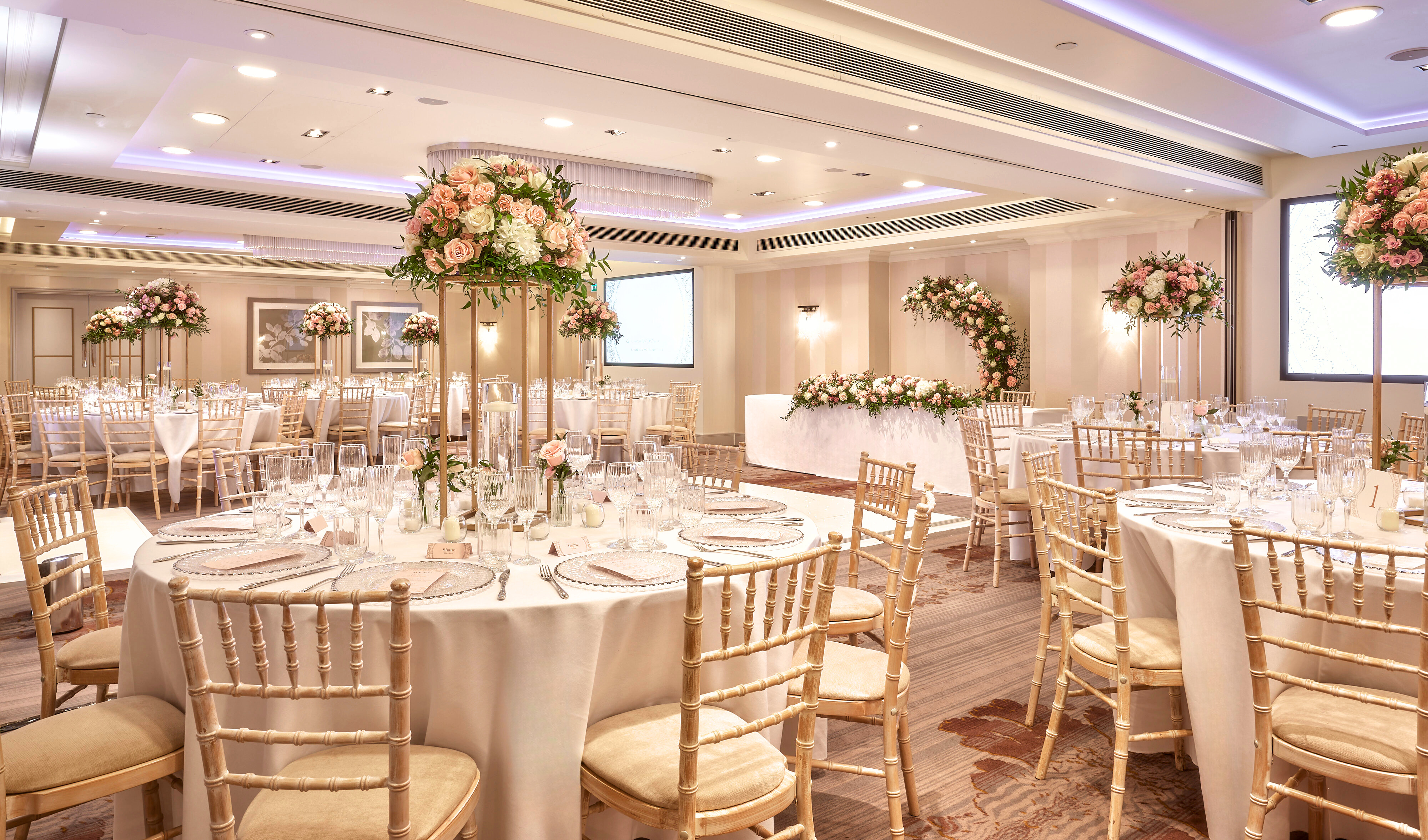 Westminster Suite at Sofitel London, elegant wedding venue with floral centerpieces.