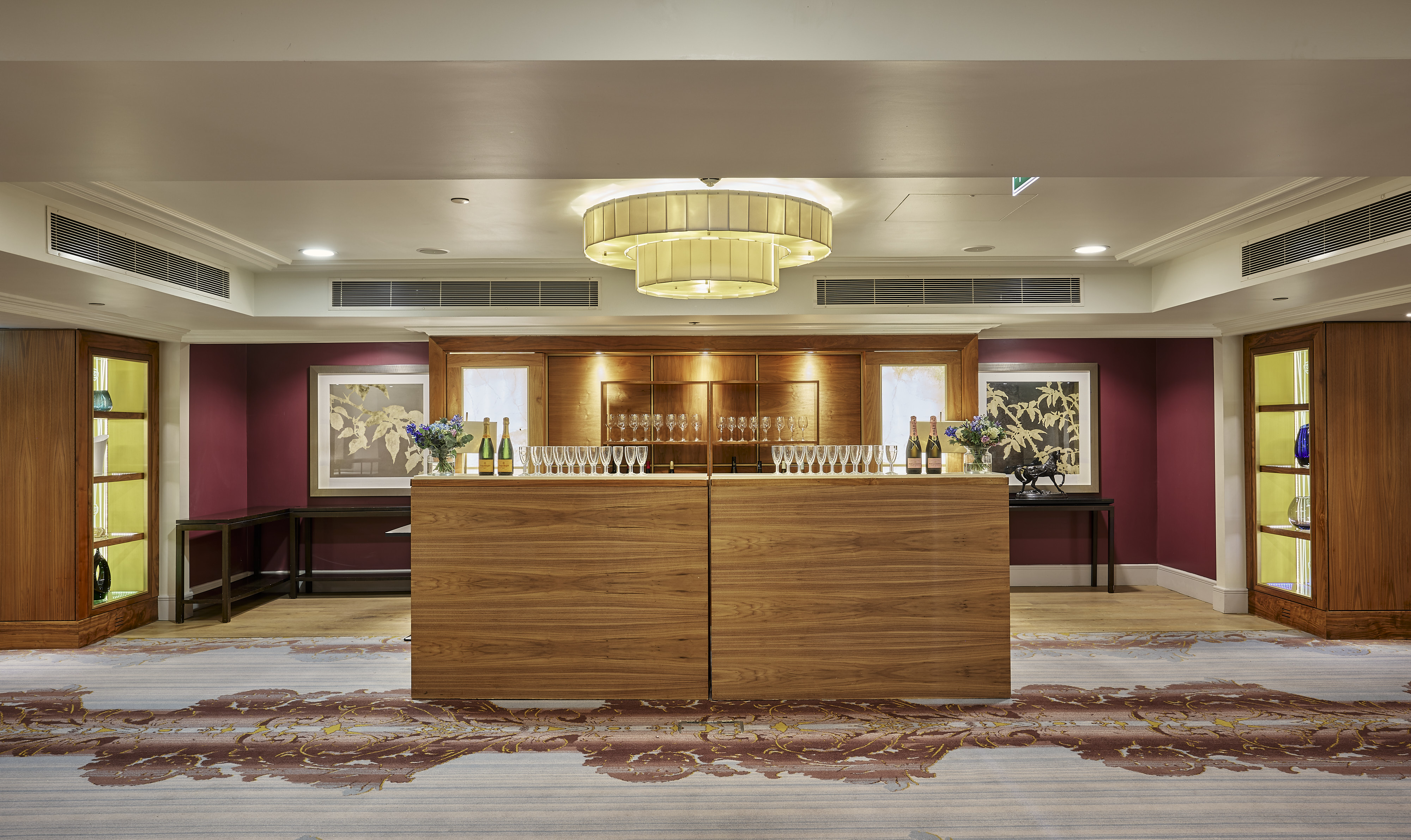 Mayfair Suite at Sofitel London: elegant event space with modern chandelier, ideal for networking.