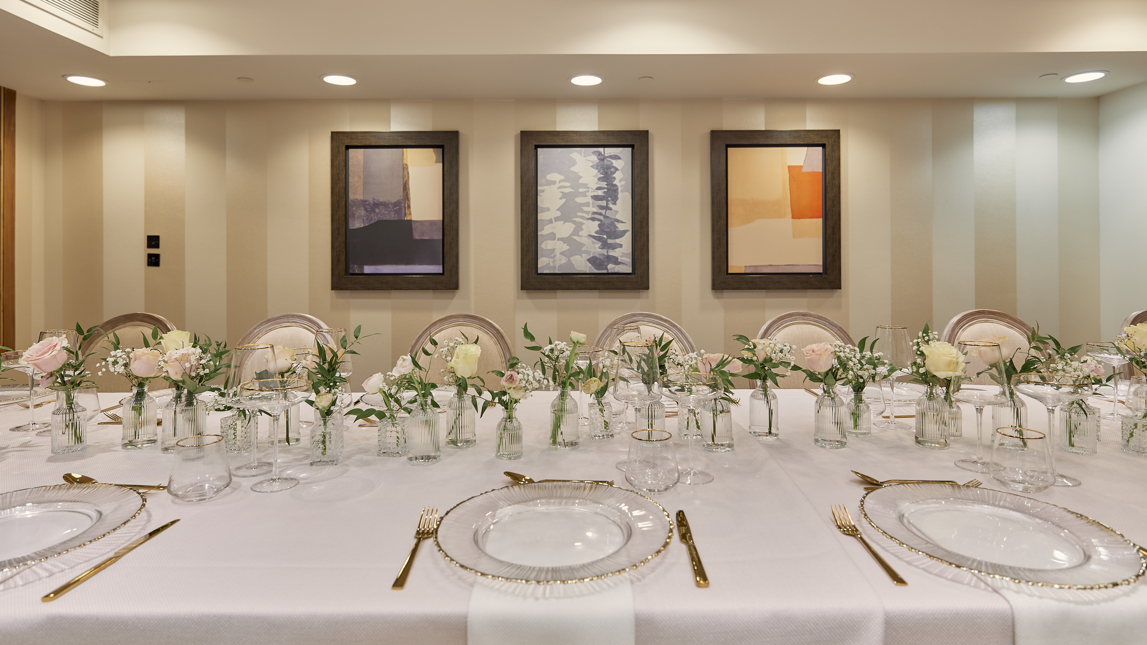 Elegant dining table with floral centerpieces for corporate events in Sofitel London.
