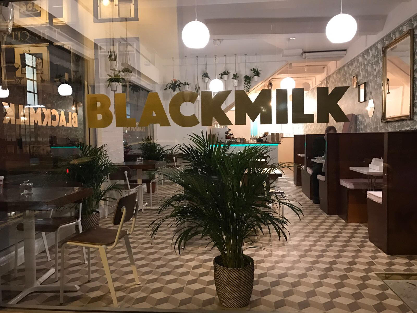 Stylish Black Milk Cafe venue with elegant decor, perfect for intimate events and networking.