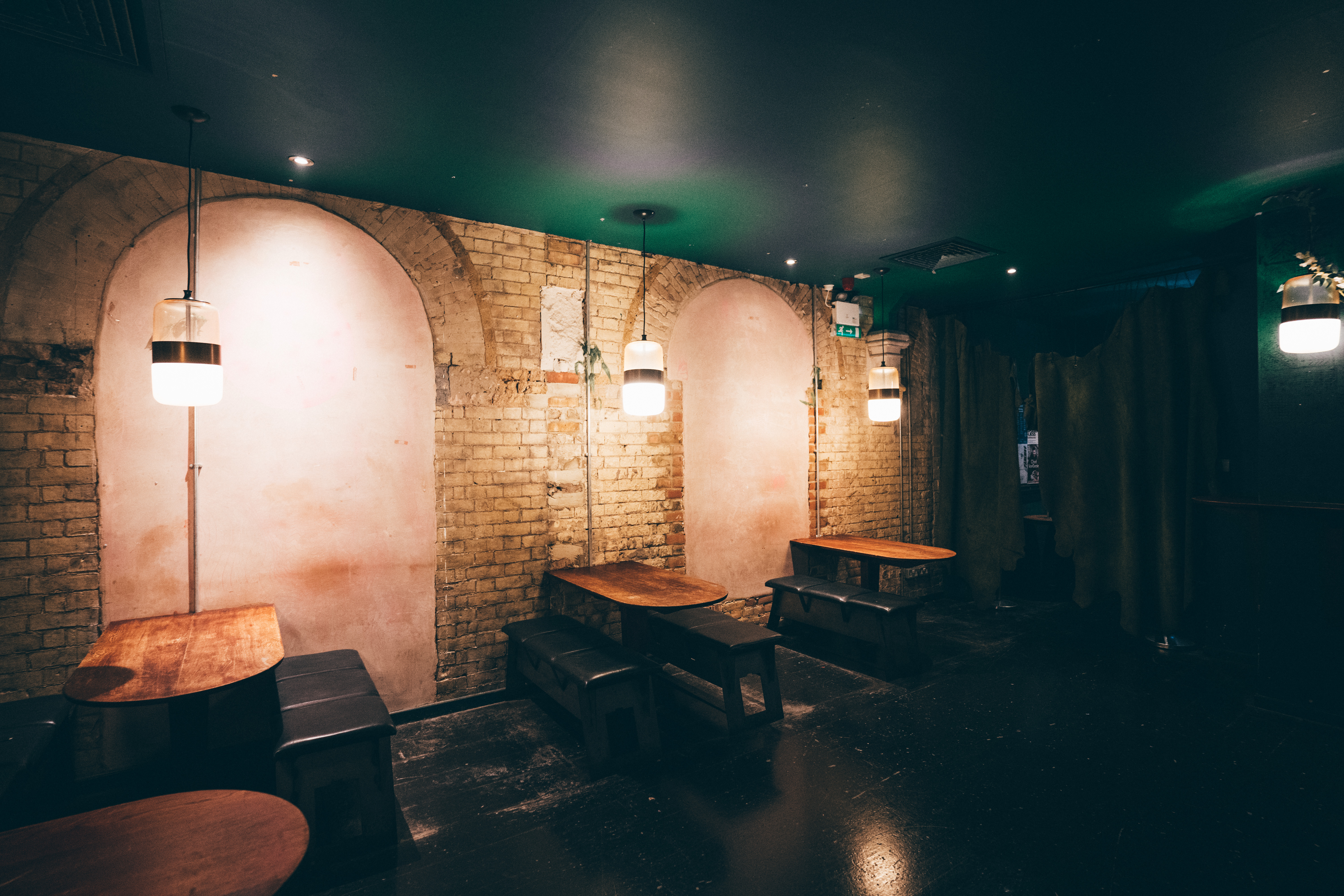 Stylish Green Room in Oslo Hackney with exposed brick, ideal for networking events.