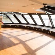 Modern meeting space with large windows, ideal for creative brainstorming events.