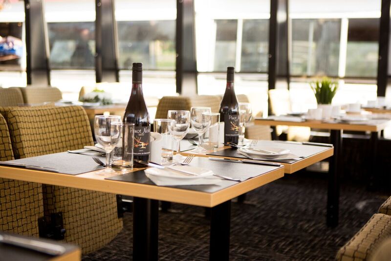 Elegant dining setup on M.V. Millennium Time for corporate events and gatherings.