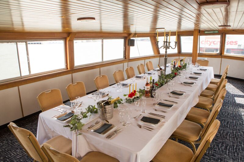 Elegant dining setup on M.V. Westminster for corporate events and private celebrations.