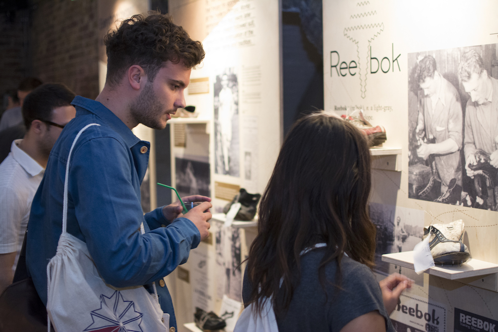 Engaging event setup in Shoreditch Studios with interactive displays for networking.