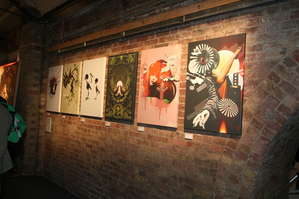 Vibrant contemporary art in Shoreditch Studios' rustic gallery for creative events.