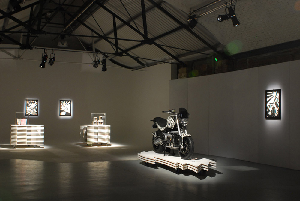 Modern event space in Shoreditch with a striking motorcycle centerpiece for exhibitions.