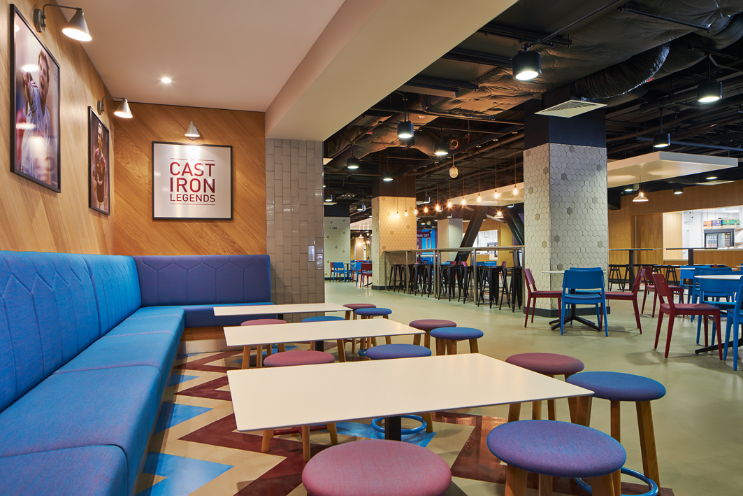 The Boleyn event space in London Stadium, featuring vibrant seating for networking events.