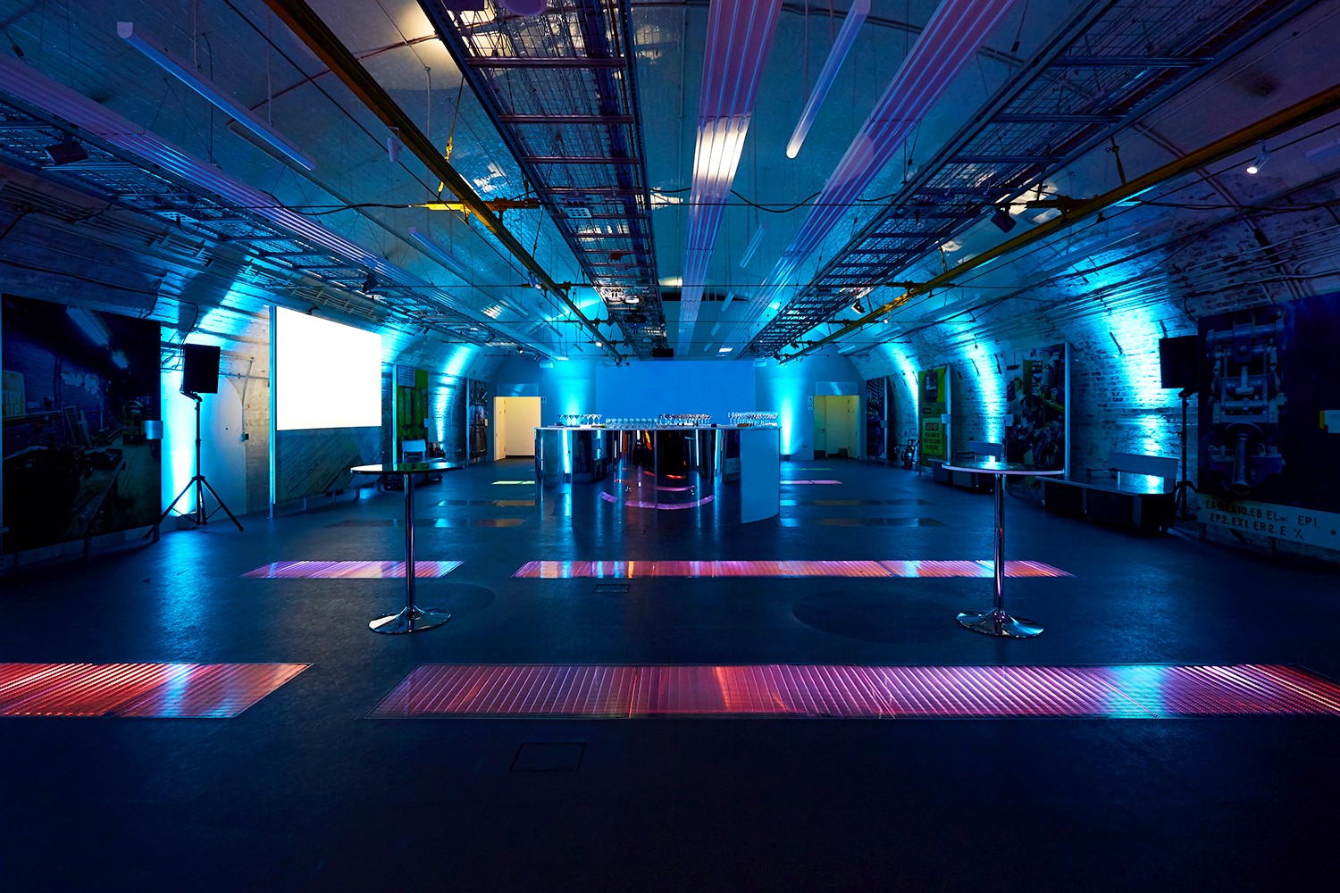 Mail Rail event space in The Postal Museum with ambient blue lighting for networking events.