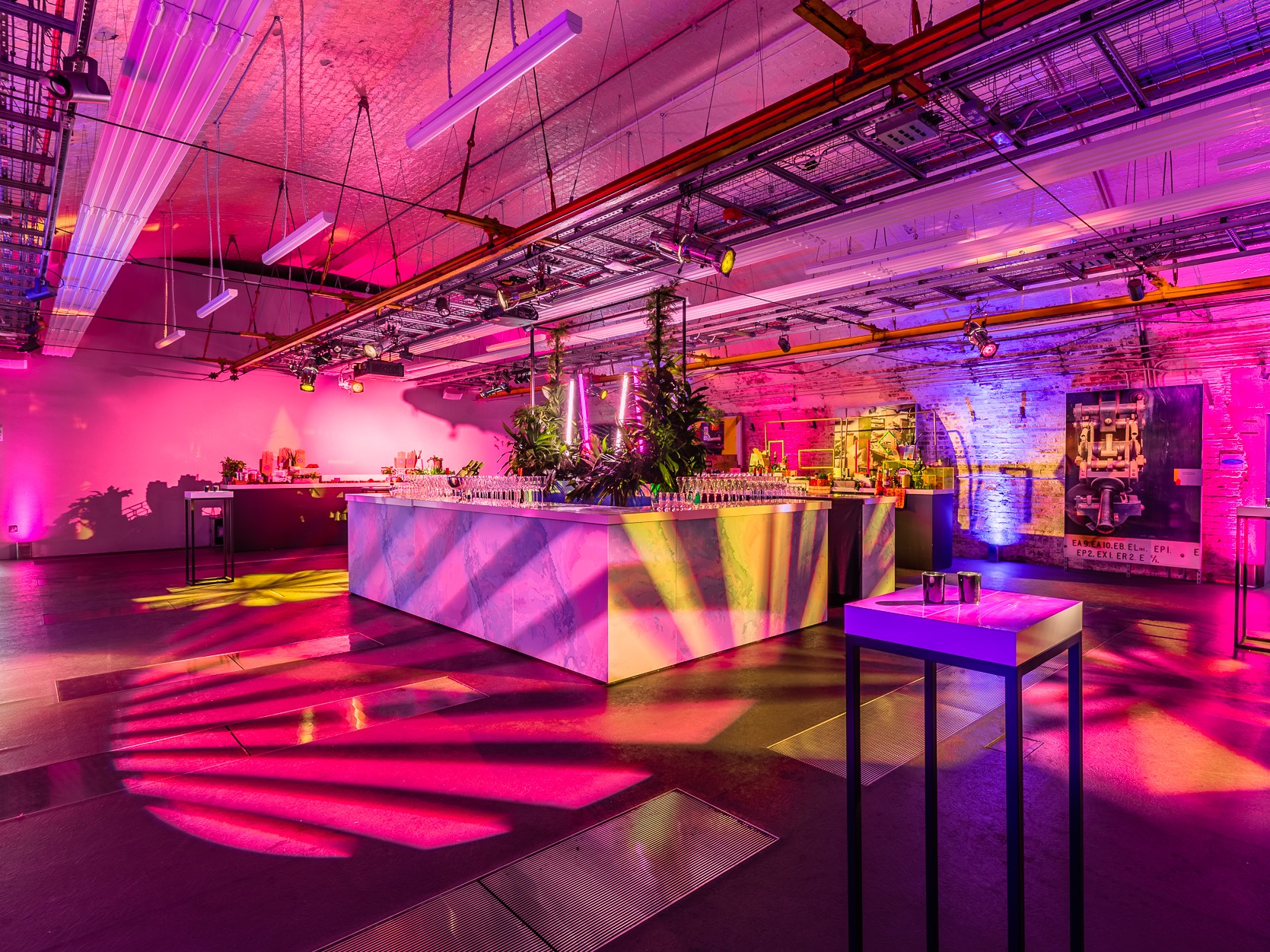 Mail Rail event space with vibrant lighting, ideal for upscale gatherings and networking.