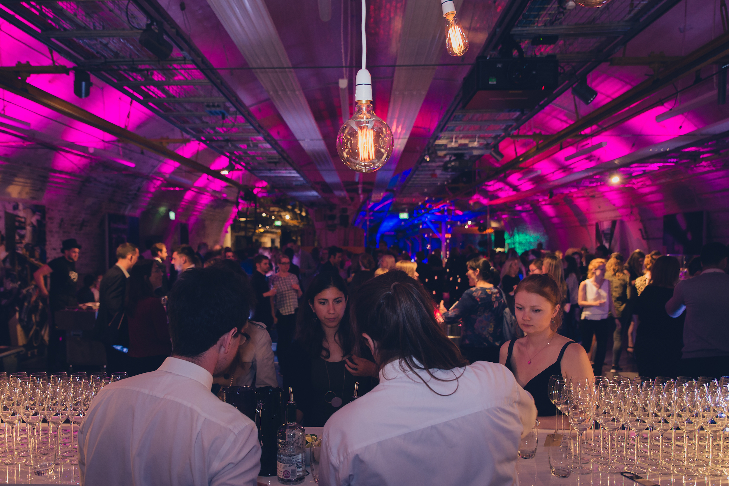 Mail Rail event space at The Postal Museum, vibrant lighting, networking gathering.