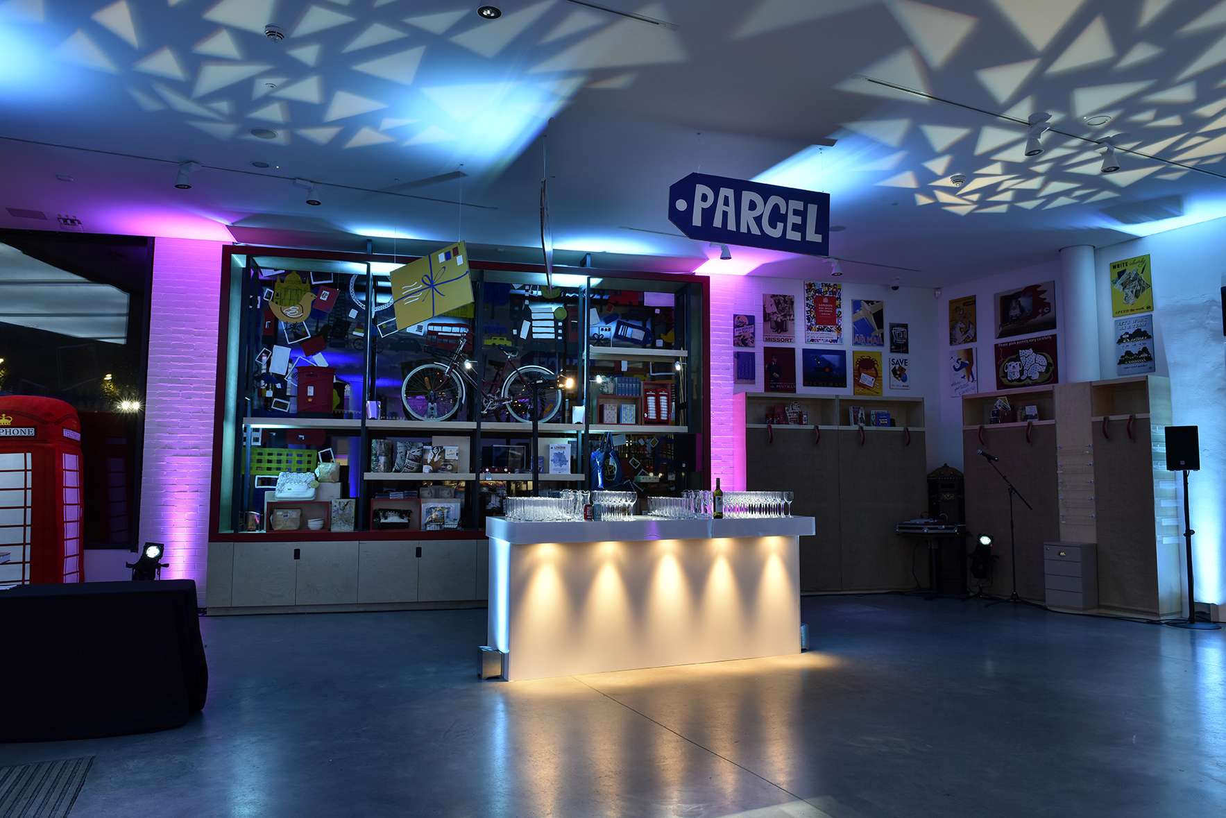 Vibrant event space at The Postal Museum with modern bar and eclectic decor for gatherings.