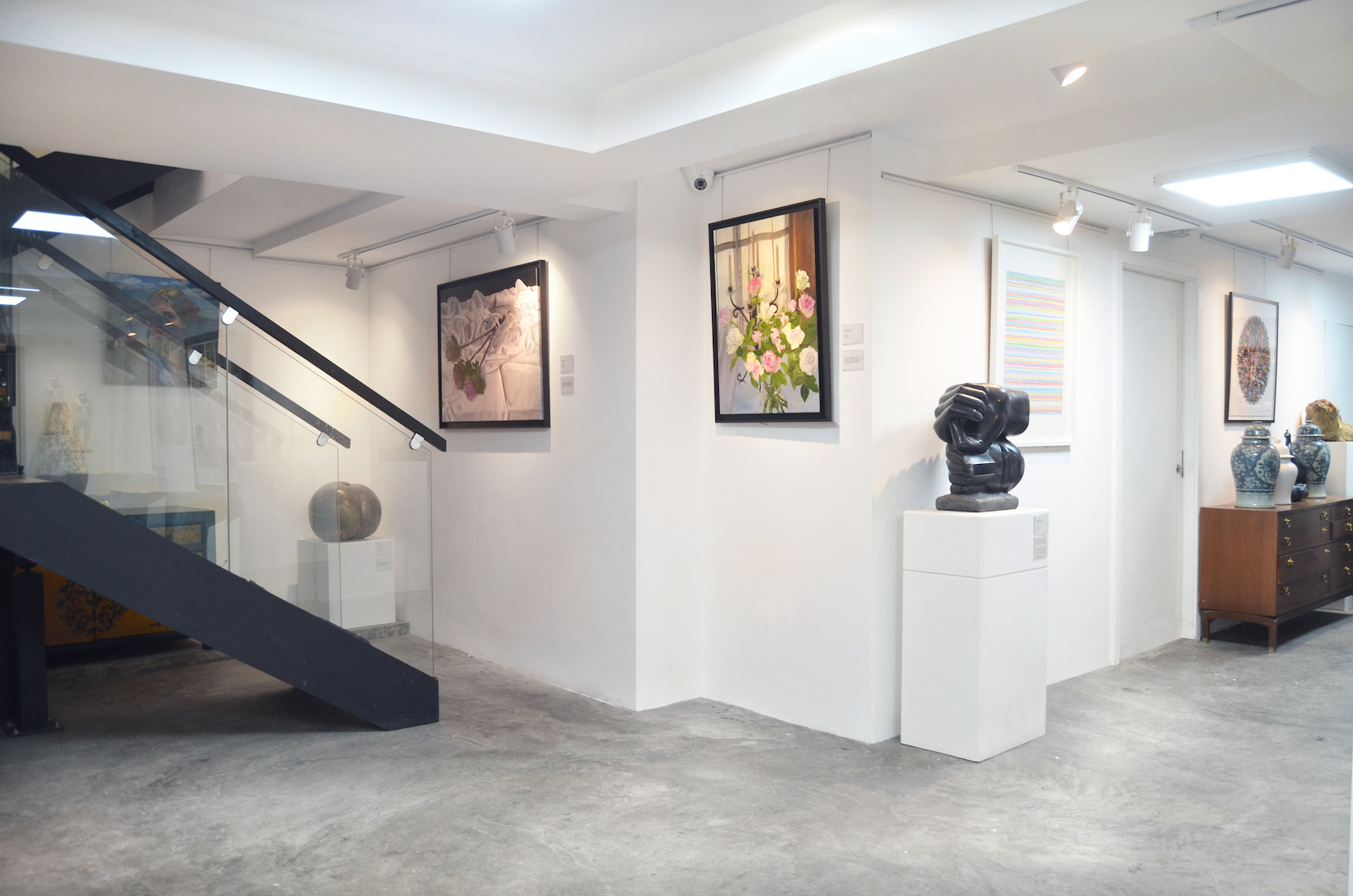 Modern gallery space with artwork, ideal for art events and meetings at Sunny Art Centre.
