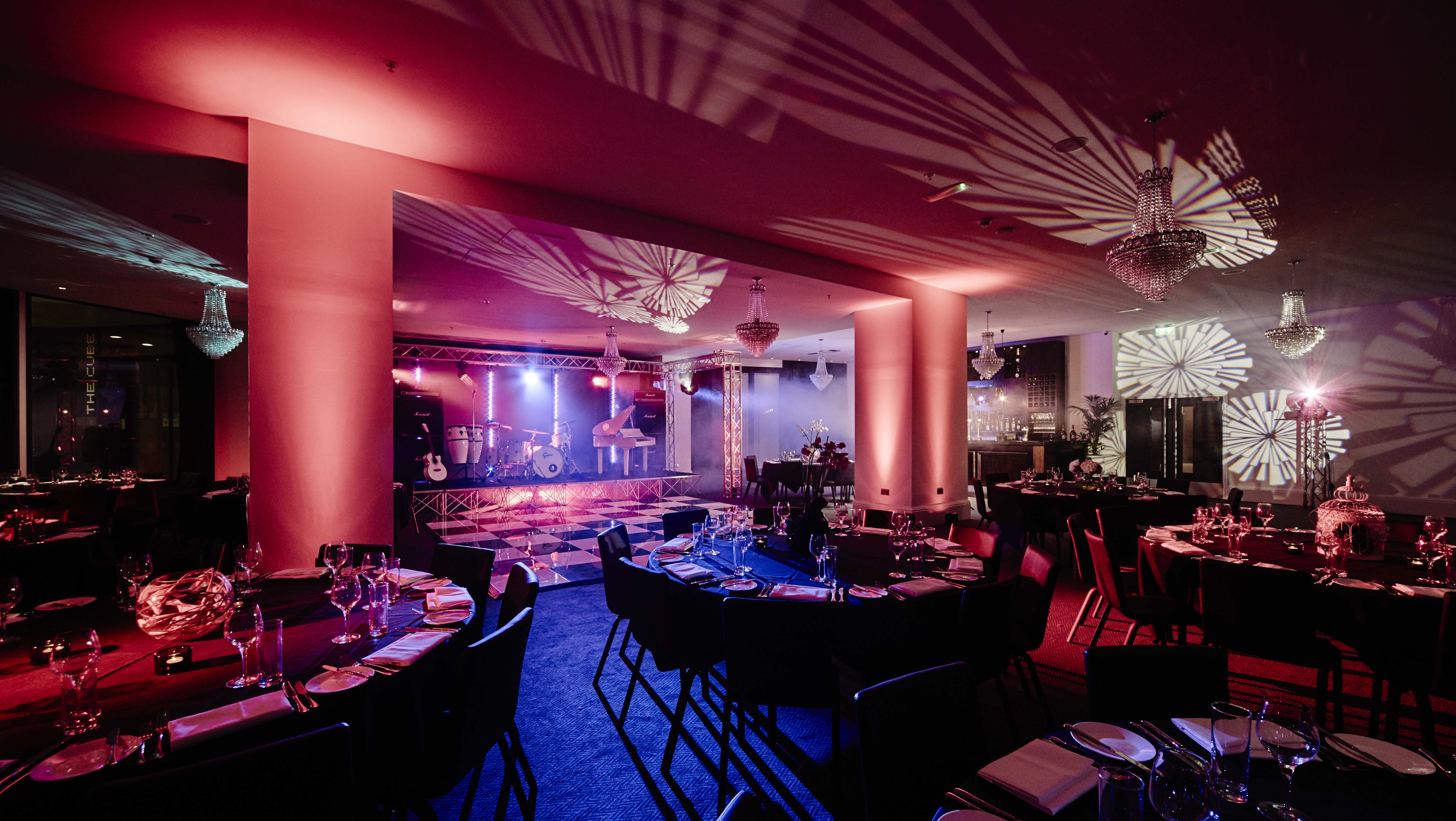 Elegant Canalside venue with fine dining setup for corporate events and galas.