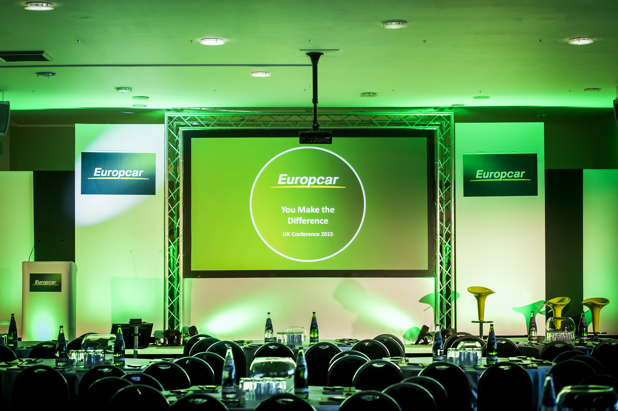 Walkers Hall at Leicester City FC, corporate event space with green lighting and branding.