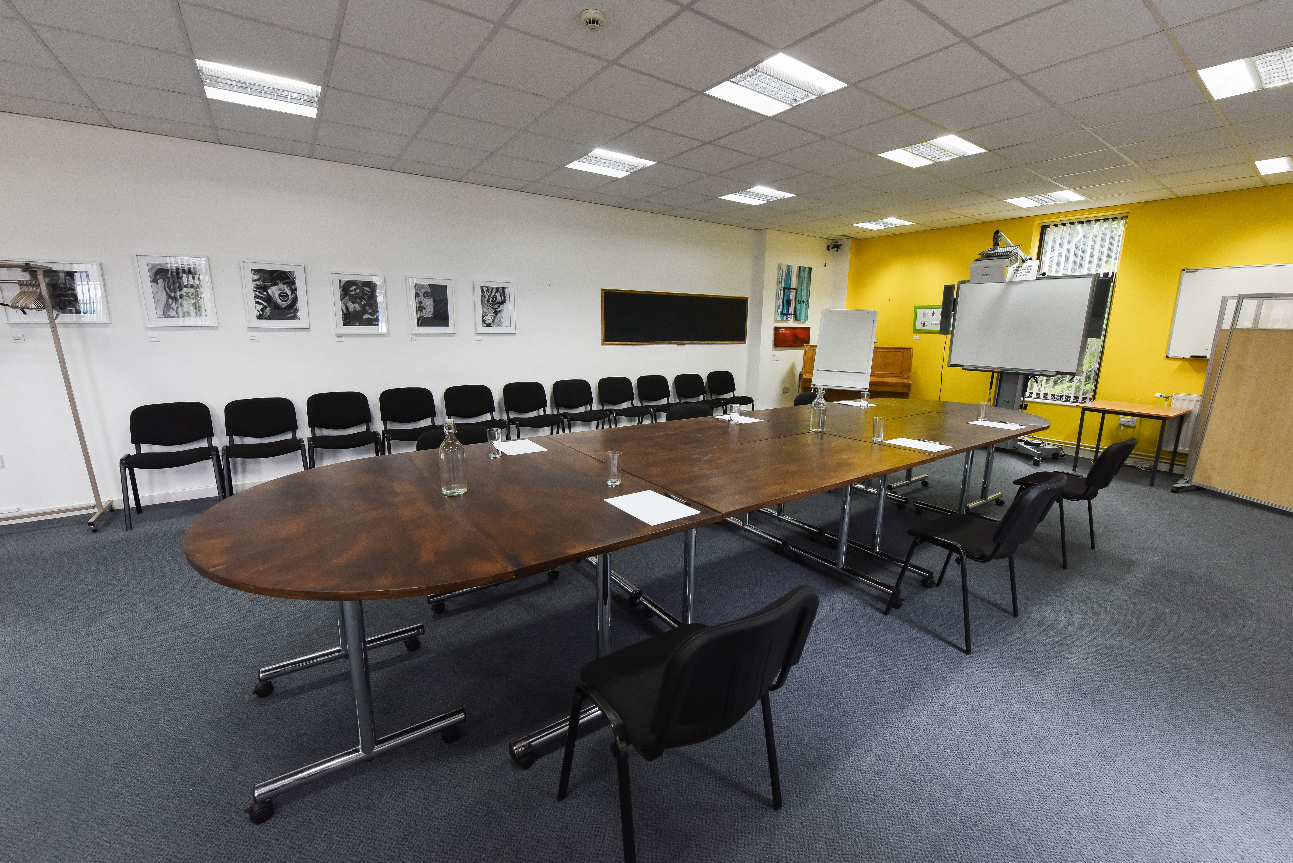 Meeting Room at The Brain Charity with oval table for collaborative brainstorming sessions.