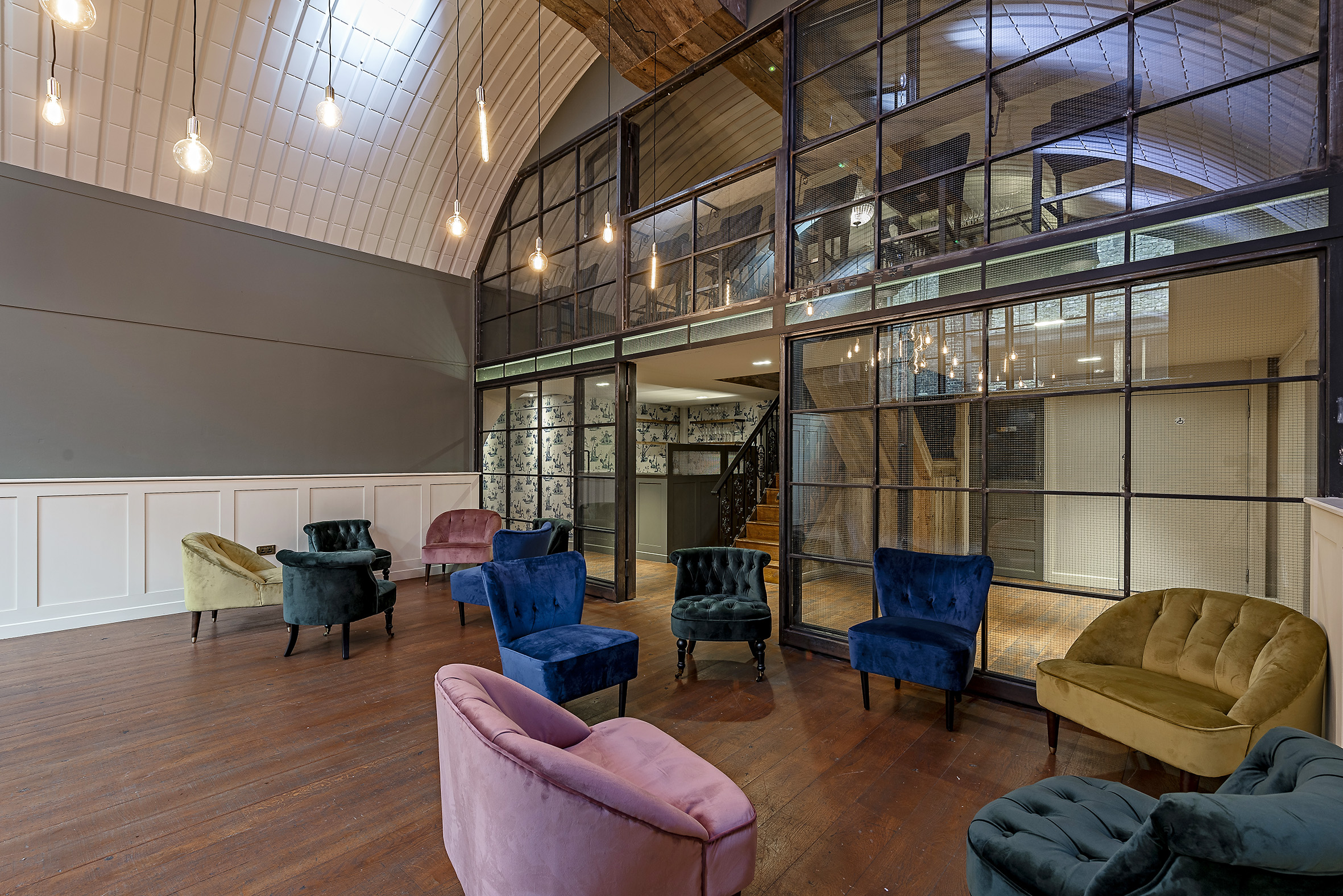 Sophisticated meeting space with plush chairs, ideal for conferences and events.