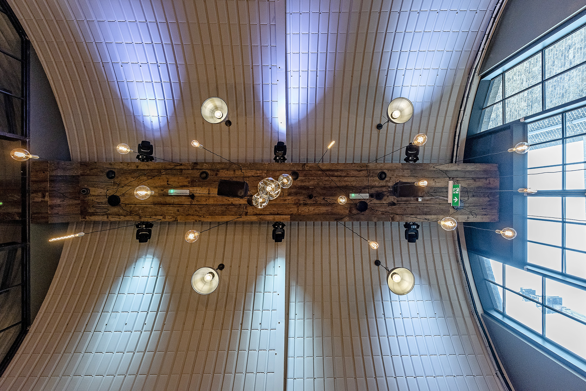 Whole Venue at Rae's: modern meeting space with wooden table and pendant lighting.