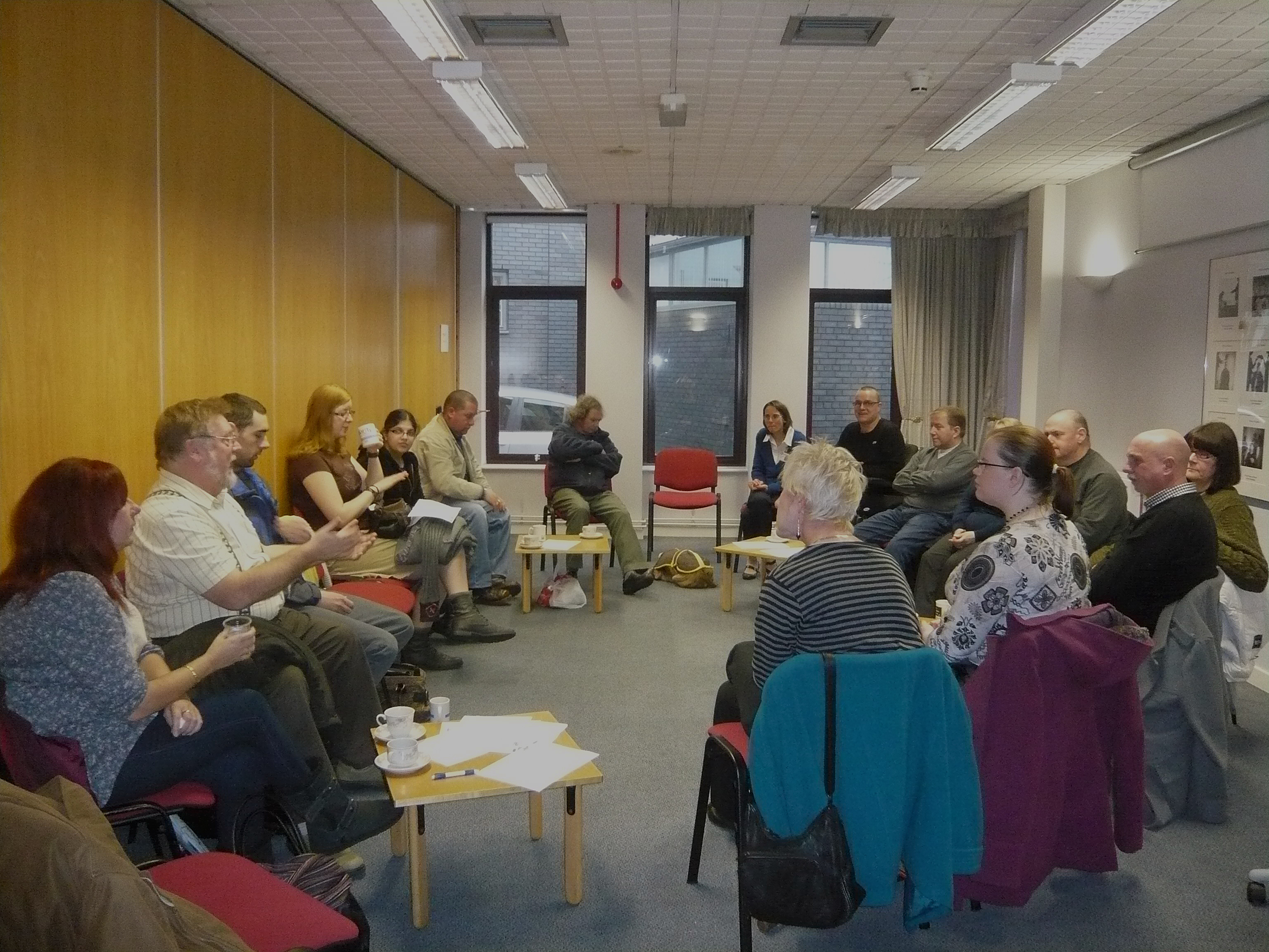 Collaborative lounge for brainstorming sessions with circular seating arrangement.