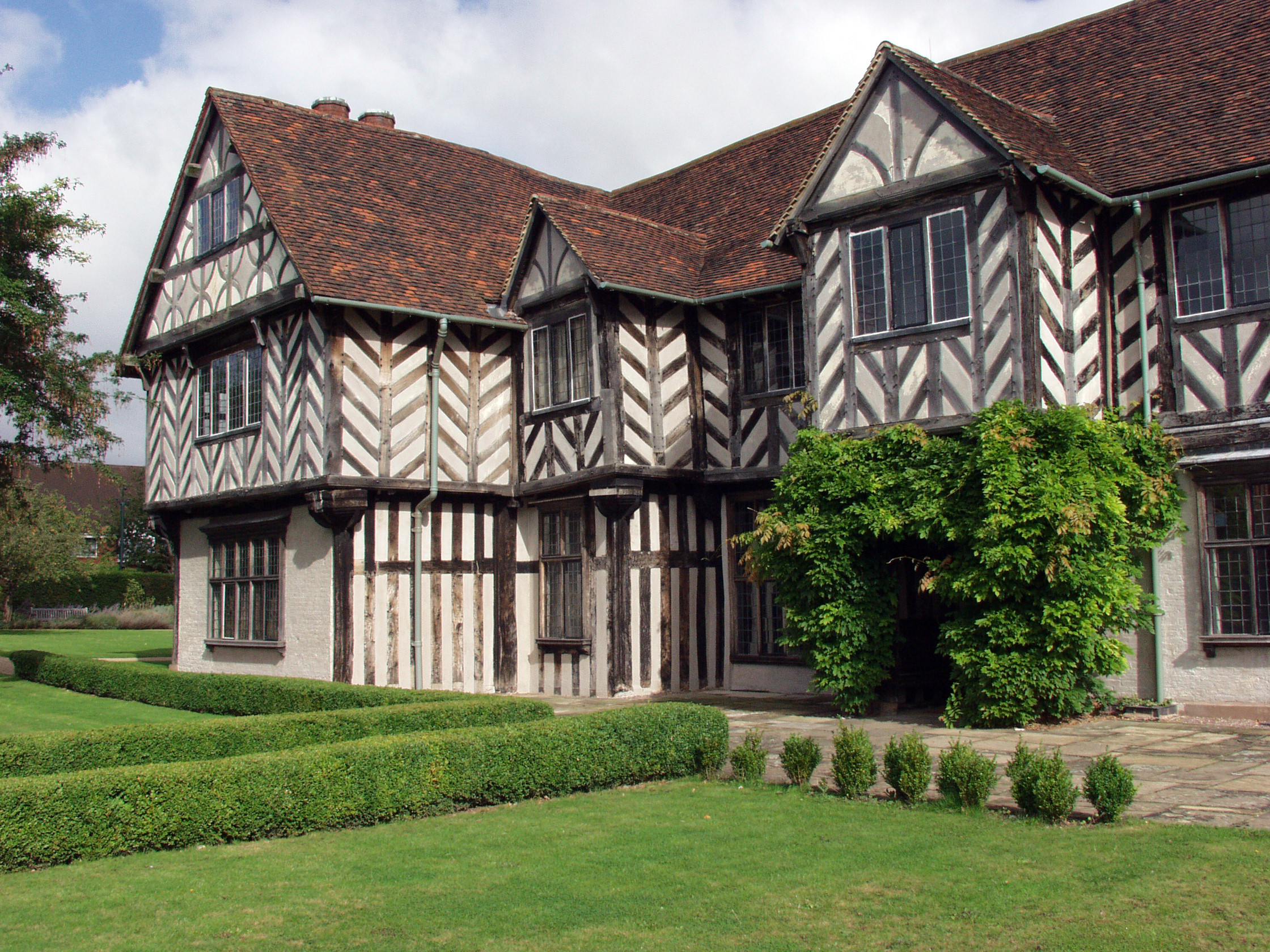Historic Blakesley Hall gallery with half-timbered facade, perfect for unique events.