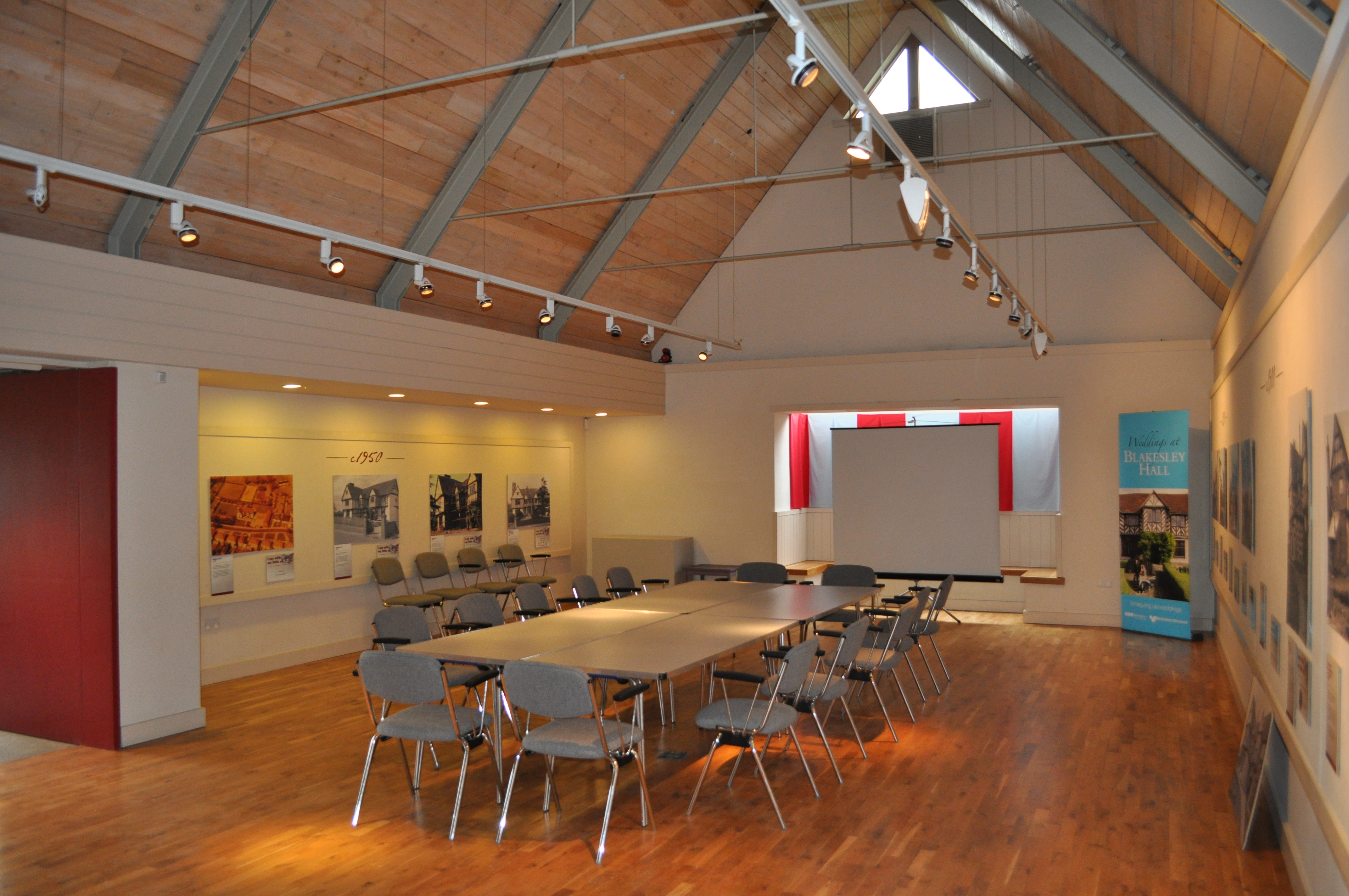 Versatile meeting space at Blakesley Hall with high ceilings for workshops and presentations.