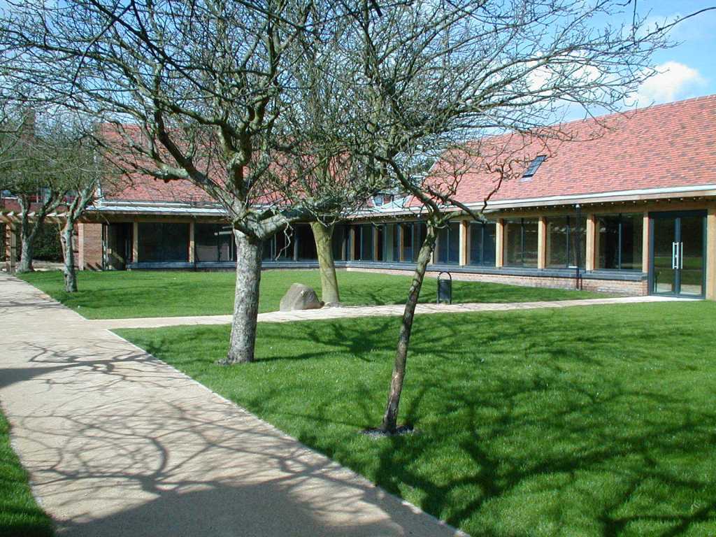 Serene Blakesley Hall gallery with greenery, ideal for meetings and events.