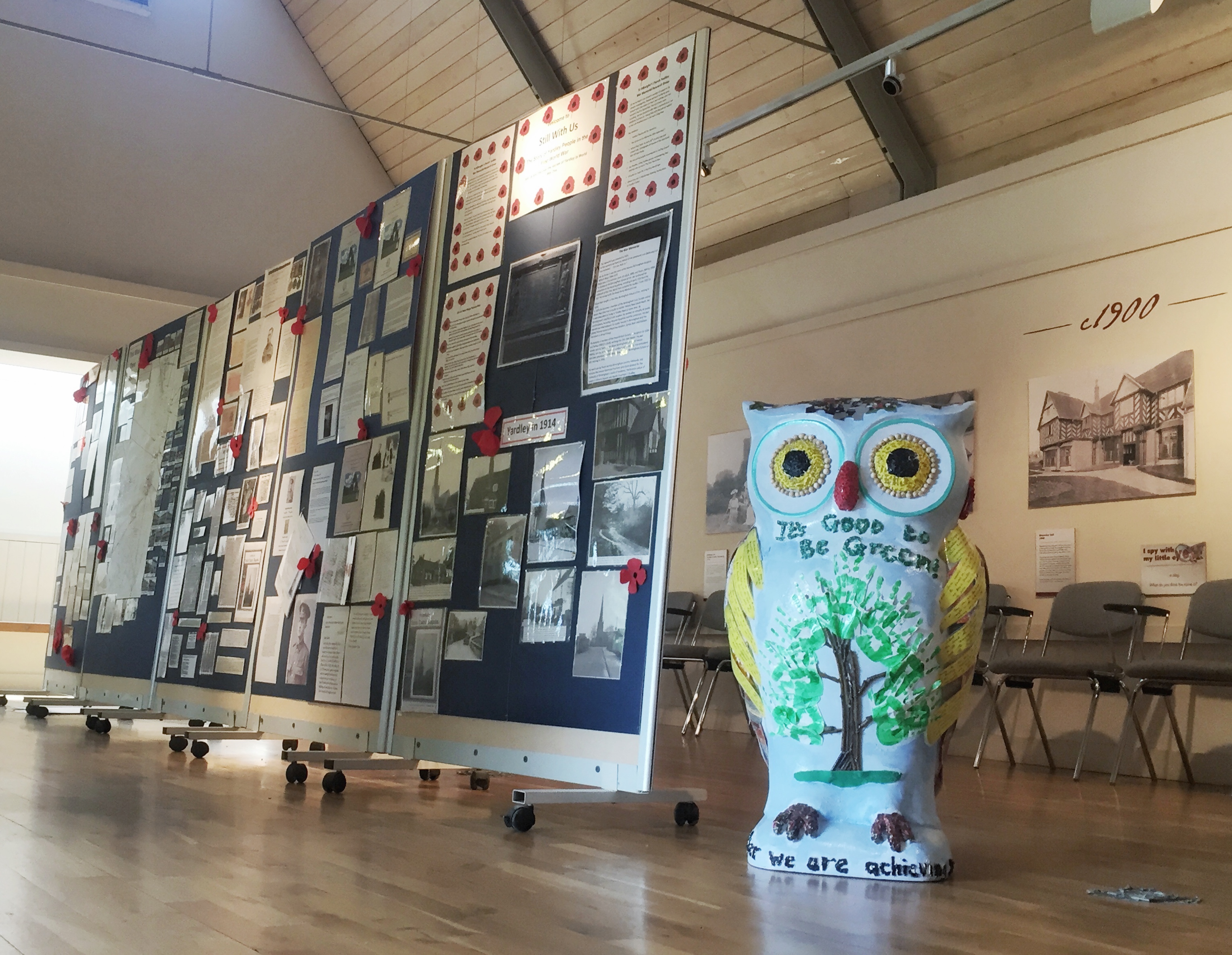 Blakesley Hall gallery with display boards and owl decor for community events.