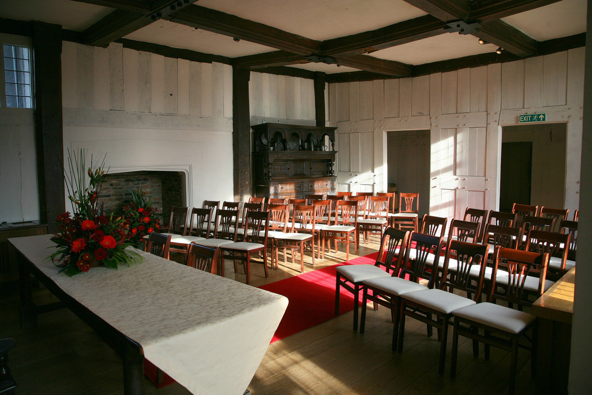 Great Hall at Blakesley Hall, elegant meeting space with red carpet for events.